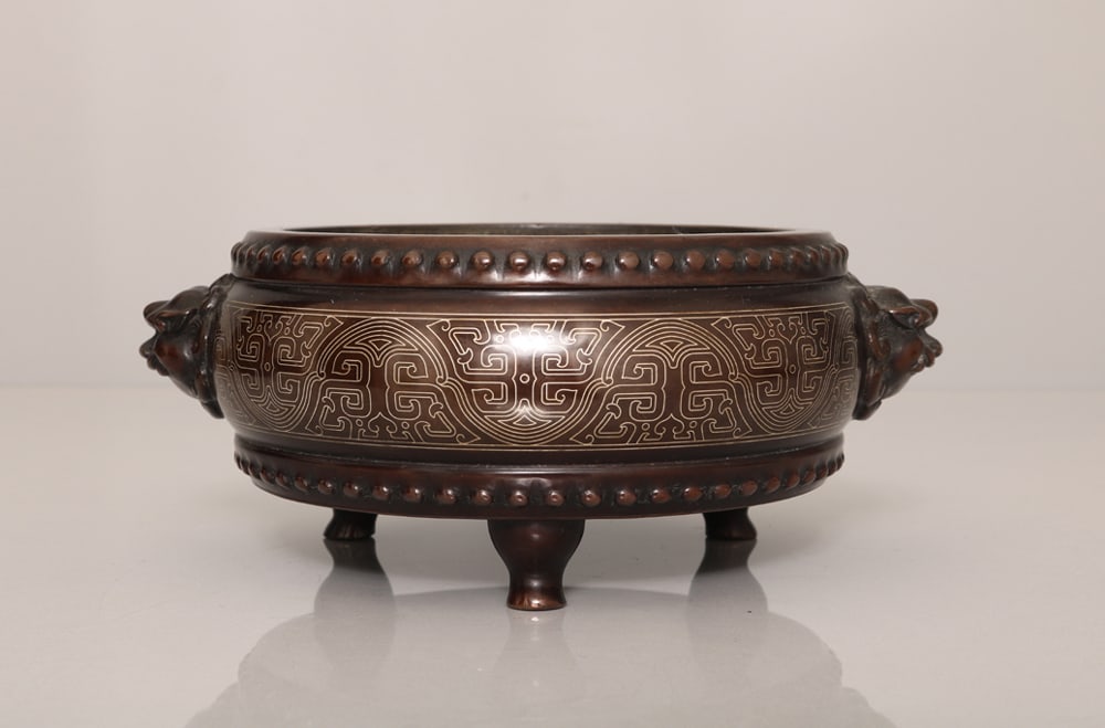An Exquisite Bronze inlaid Silver Wire Tripod Beast-Ears Censer: An Exquisite Bronze inlaid Silver Wire Tripod Beast-Ears Censer,Ming Dynasty, China,With Mark,Size:3.1inx7.7in,Weight:2521g
