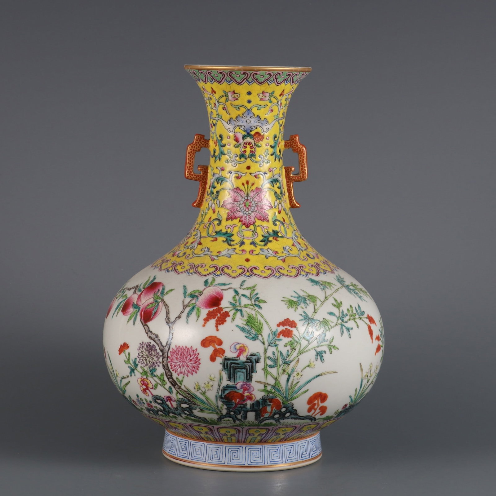 An Exquisite Yellow Ground Famille-Rose Flower and Fruit Pattern Double-Ears Vase: An Exquisite Yellow Ground Famille-Rose Flower and Fruit Pattern Double-Ears Vase,Qing Dynasty, China,With Mark,Size:10.6inx7.1inx3.3in