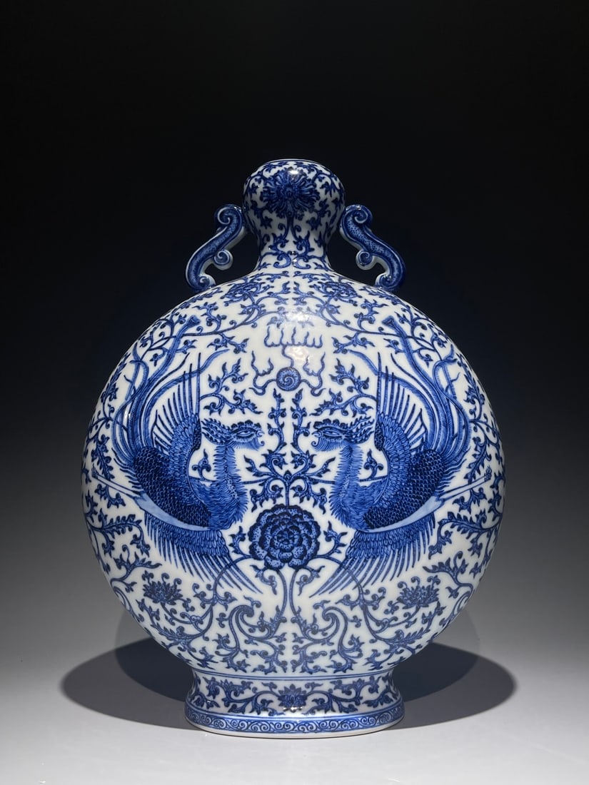 An Exquisite Blue and White Phoenix Pattern Ruyi-Ears Ewer: An Exquisite Blue and White Phoenix Pattern Ruyi-Ears Ewer,Qing Dynasty, China,Qianlong Six-character Mark,Size:15.4inx11in 青花凤纹如意耳壶,中