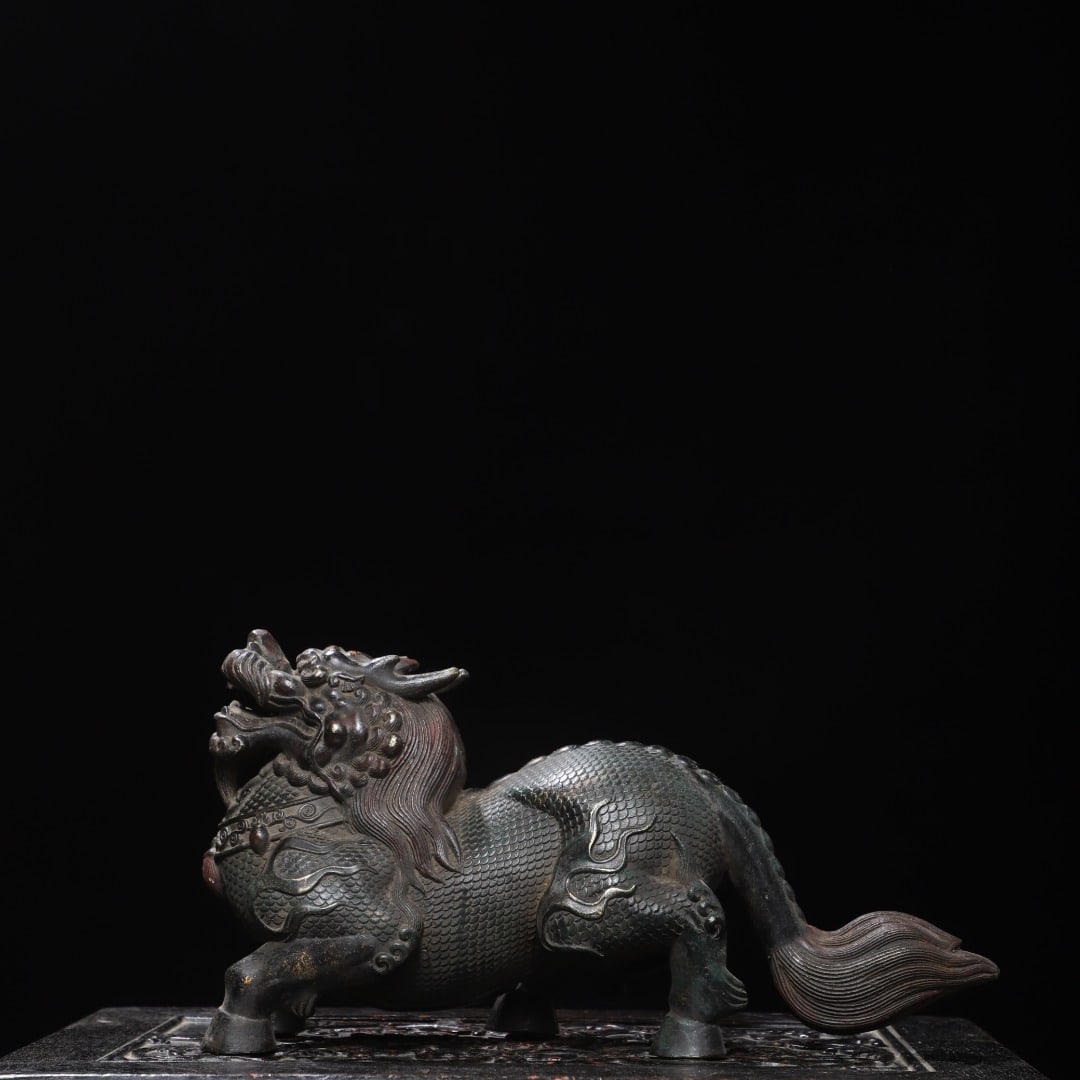 An Exquisite Bronze Gold Printed Kylin Ornament: An Exquisite Bronze Gold Printed Kylin Ornament,Ming Dynasty, China,Yongle Six-character Mark,Size:6.7inx13inx2.8in,Weight:3880g 铜拓金麒麟摆件,中ࢲ