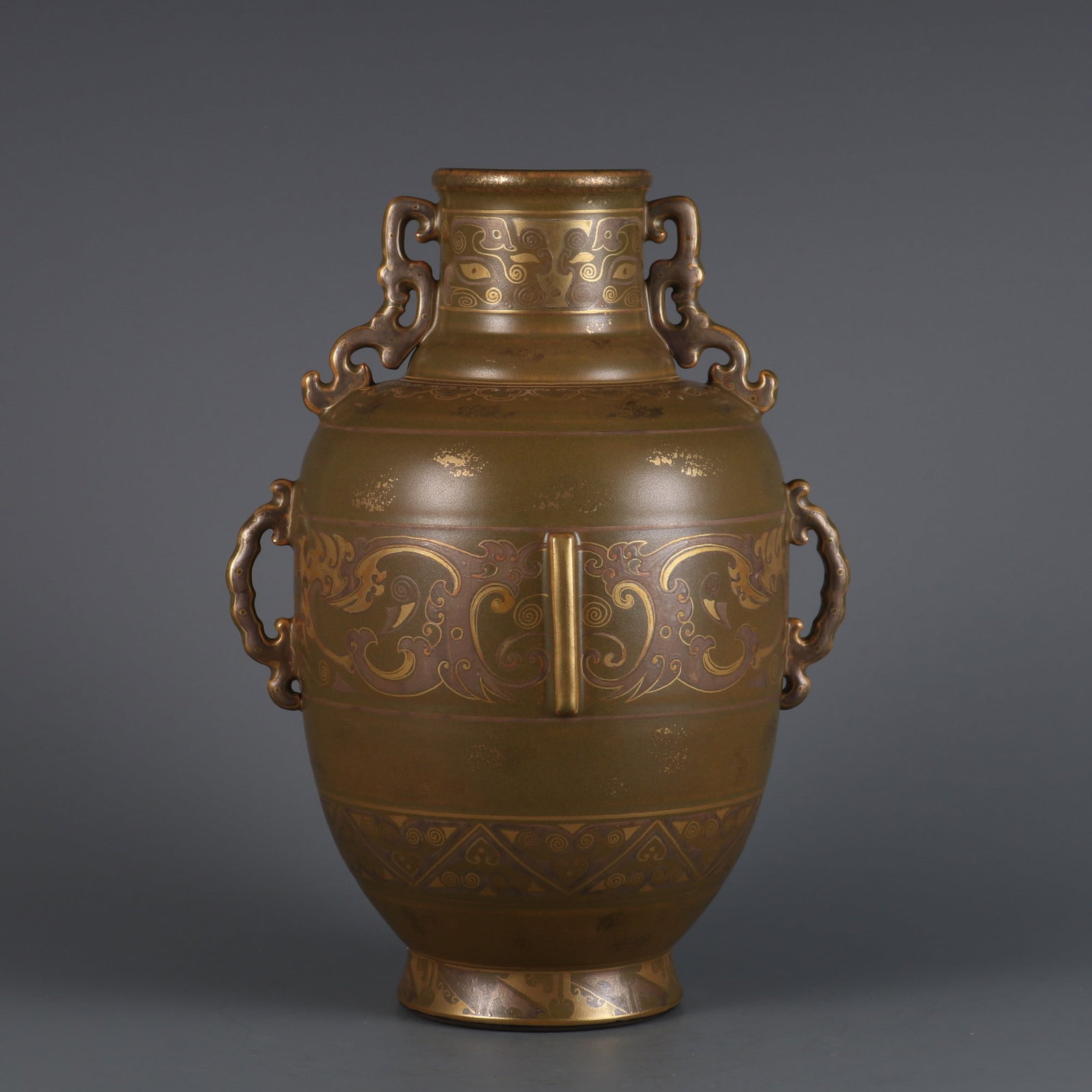 An Exquisite Teadust Glazed Painted Gold Beast-Face Pattern Vase: An Exquisite Teadust Glazed Painted Gold Beast-Face Pattern Vase,Qing Dynasty, China,Qianlong Six-character Mark,Size:10.2inx5.9inx2.8in 茶叶末釉描金饕餮