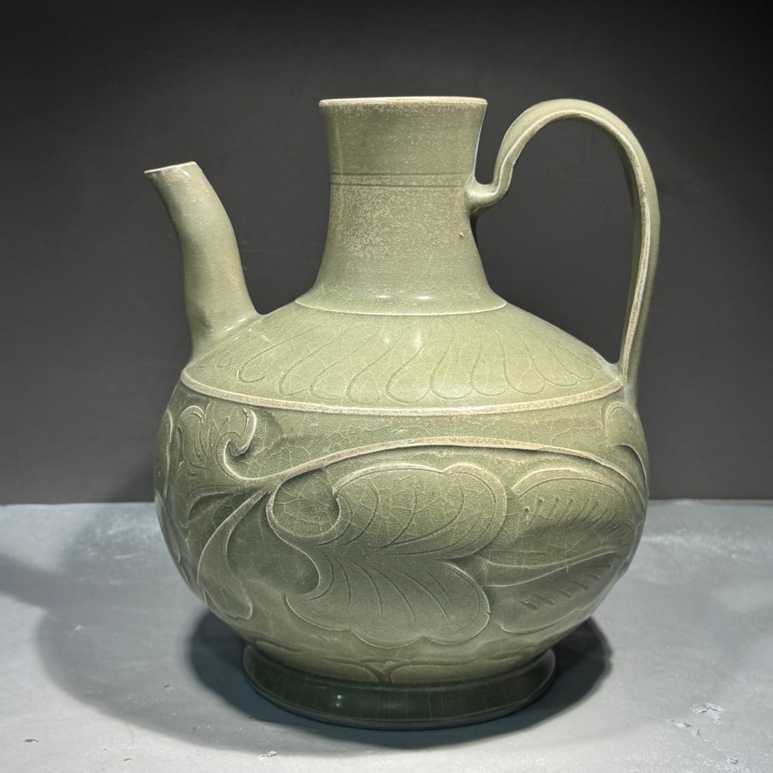 An Exquisite Yaozhou Yao Celadon Glazed Flower Pattern Ewer: An Exquisite Yaozhou Yao Celadon Glazed Flower Pattern Ewer,Song Dynasty, China,Size:7.3inx6.3in 耀州窑青釉花卉纹壶,中国宋ߣ