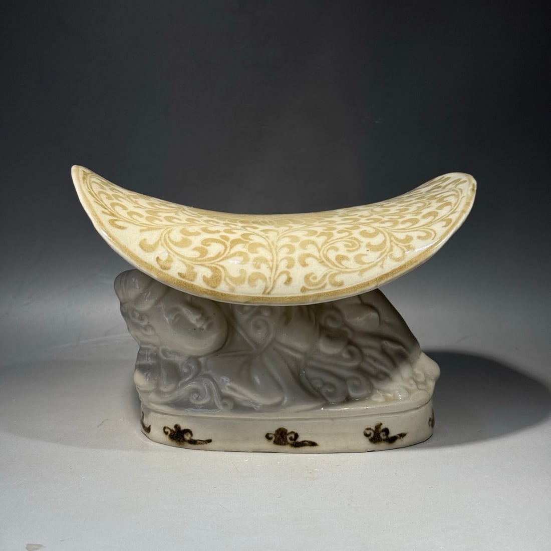 An Exquisite Ding Yao White Glazed Brown Color Figure Porcelain Pillow: An Exquisite Ding Yao White Glazed Brown Color Figure Porcelain Pillow,Song Dynasty, China,Size:5.1inx7.5in
