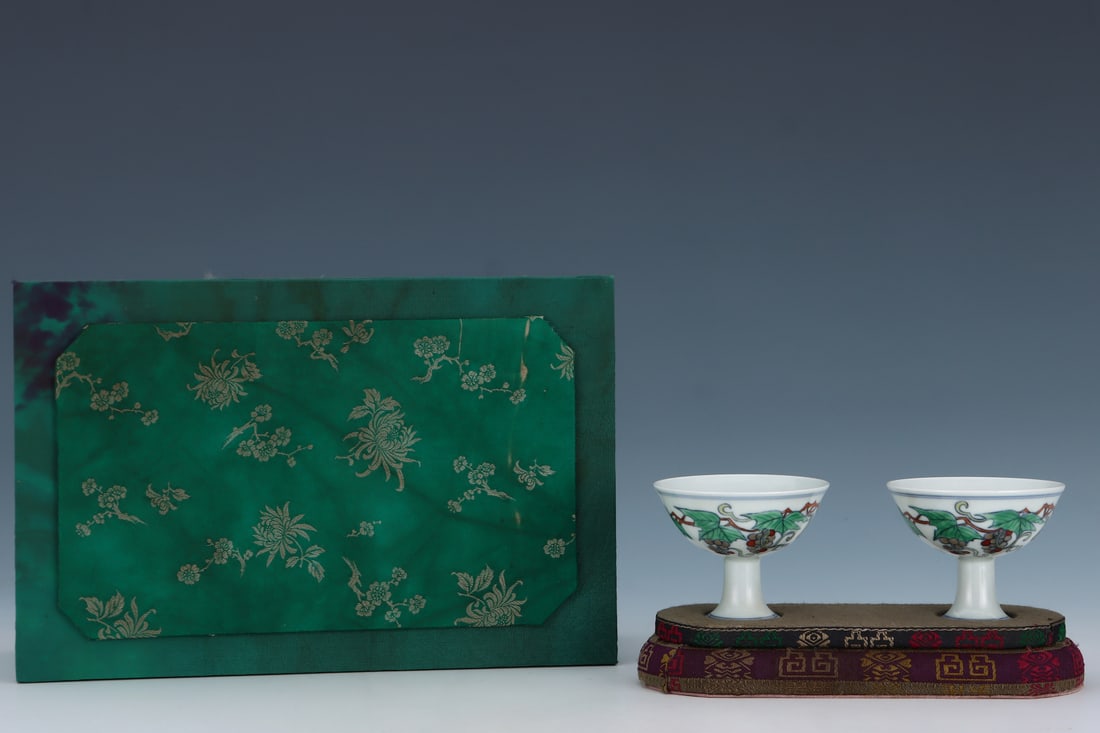 A pair of Exquisite Doucai Grapes Pattern Cups: A pair of Exquisite Doucai Grapes Pattern Cups,Ming Dynasty, China,Chenghua Six-character Mark,Size:2.6inx3.3in