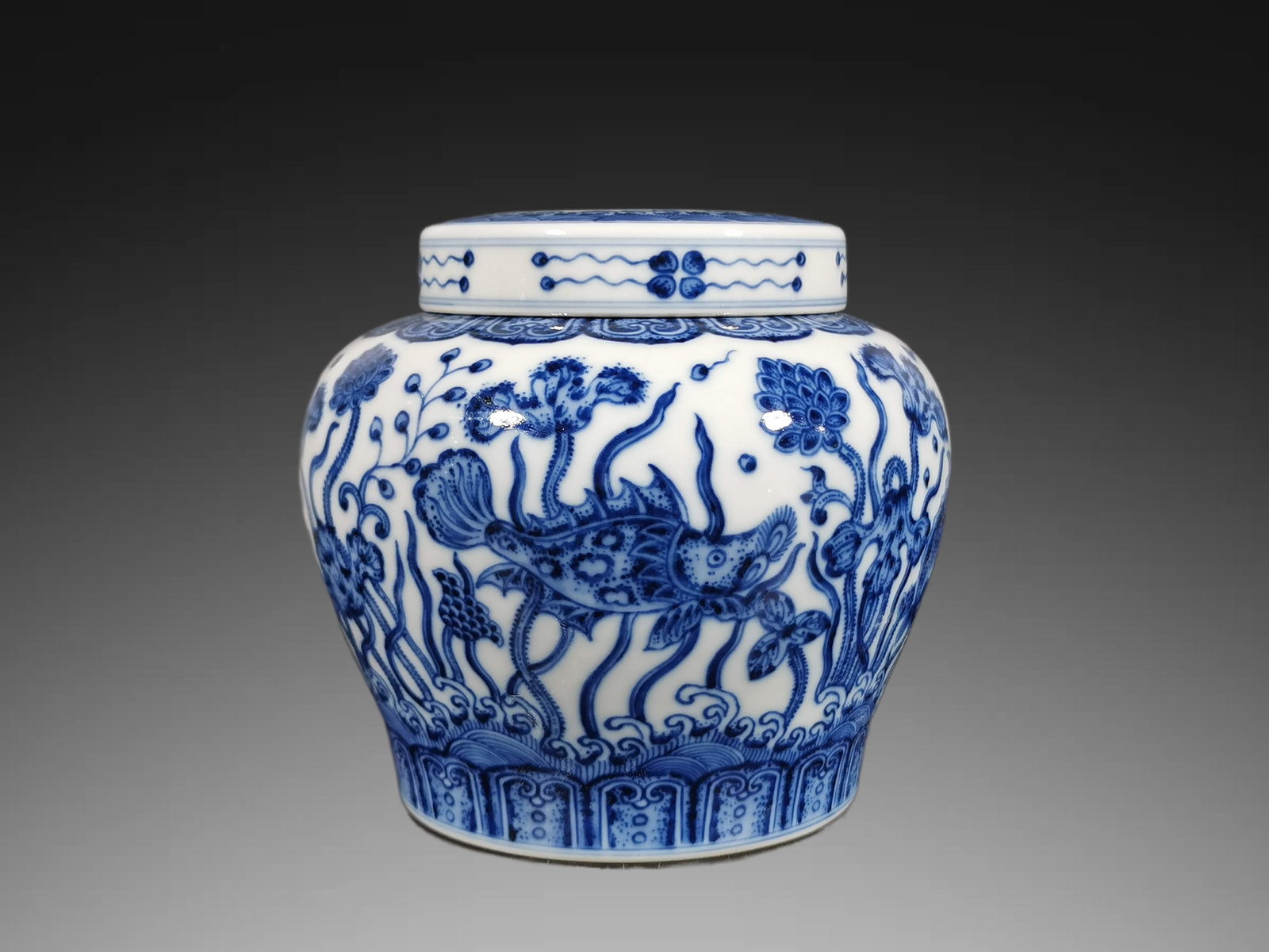 An Exquisite Blue and White Fish and Lotus Pattern Jar: An Exquisite Blue and White Fish and Lotus Pattern Jar,Qing Dynasty, China,Qianlong Six-character Mark,Size:5.3inx3.3inx5.9in 青花鱼藻纹罐,中国清&