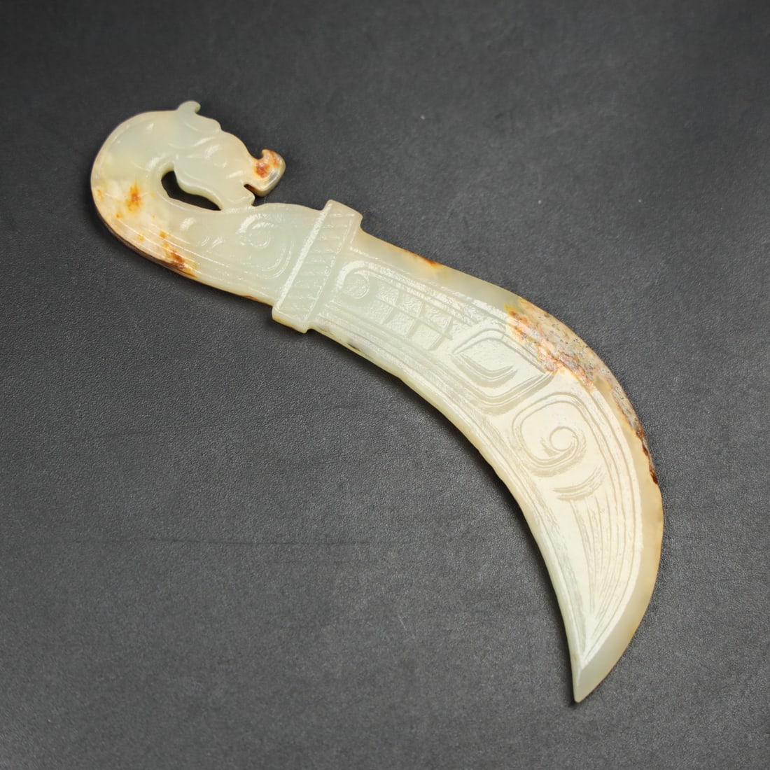 An Exquisite Hotan Jade Dragon Head Knife: An Exquisite Hotan Jade Dragon Head Knife,Han Dynasty, China,Size:3.9inx1.6inx0.2in,Weight:23g 和田玉龙头刀,中国汉代