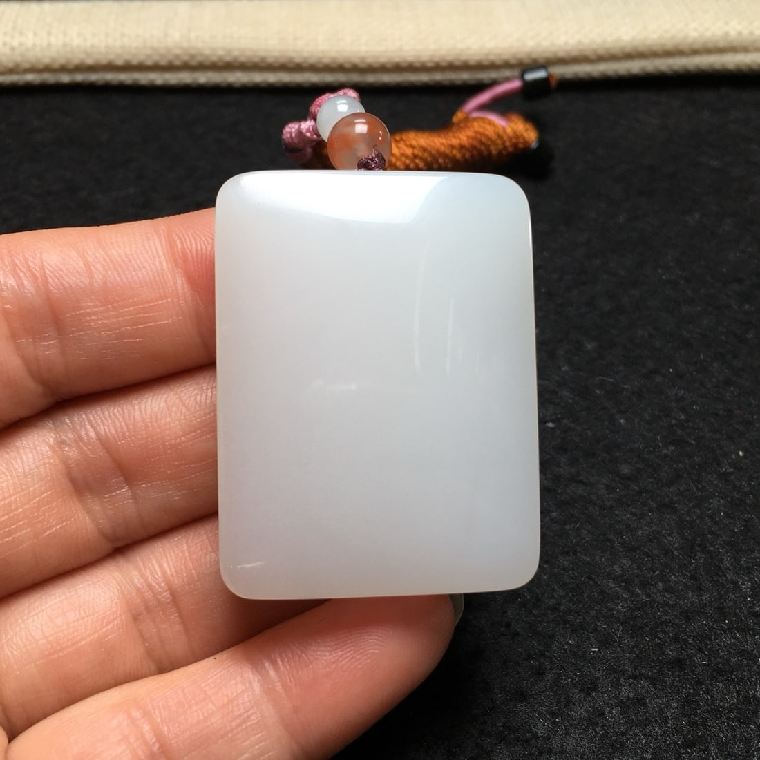An Exquisite Hotan Jade Safety Plaque: An Exquisite Hotan Jade Safety Plaque,Qing Dynasty, China,Size:1.7inx1.3inx4.7in,Weight:45g 和田玉平安牌,中国清代