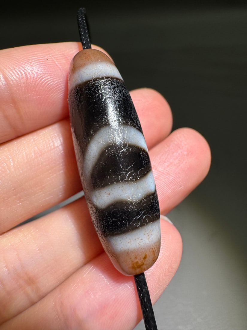 An Exquisite Ruyi Two-Eye Dzi bead: An Exquisite Ruyi Two-Eye Dzi bead,Qing Dynasty, China,Size:0.5inx1.5in 如意两眼天珠,中国清代