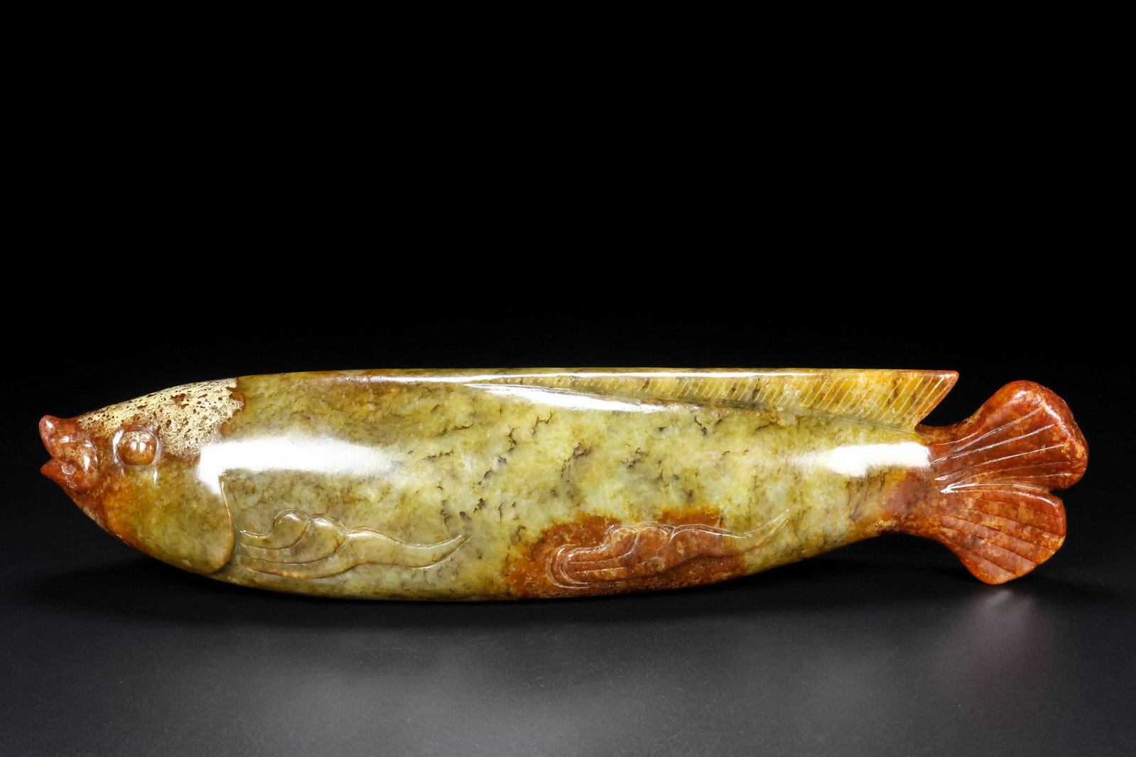 An Exquisite Hotan Jade Fish: An Exquisite Hotan Jade Fish,Han Dynasty, China,Size:9.8inx2.4inx2in,Weight:1692g 和田玉鱼,中国汉代