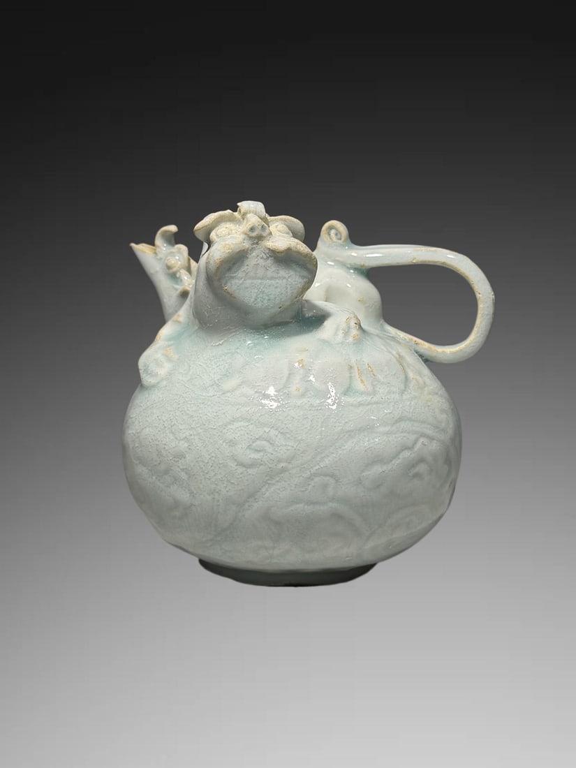 An Exquisite Hutian Yao Shadow Blue Glazed Lion Ewer: An Exquisite Hutian Yao Shadow Blue Glazed Lion Ewer,Song Dynasty, China,Size:4.5inx4.5in 湖田窑影青釉狮壶,中国宋代