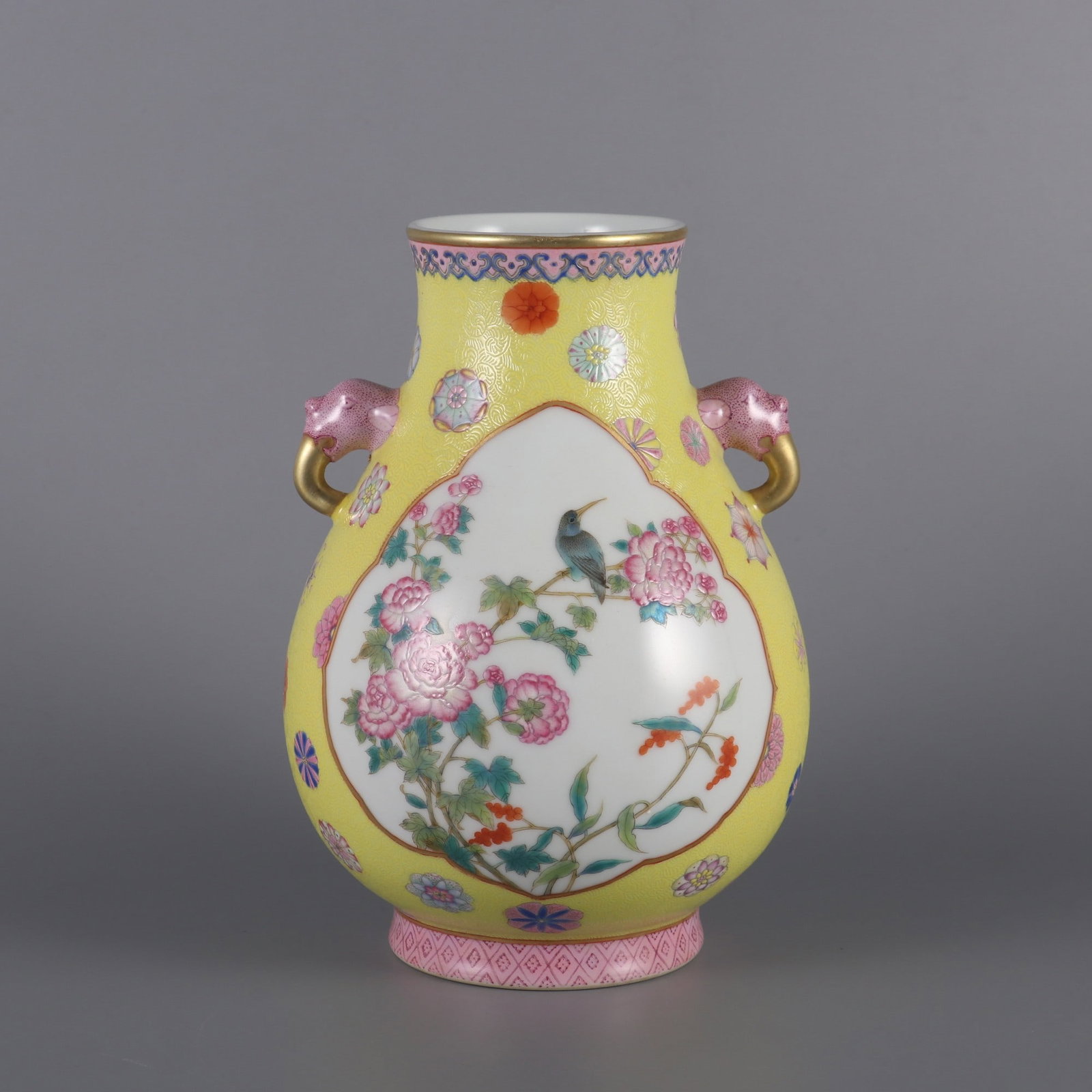 An Exquisite Yellow Ground Famille-Rose Flower and Bird Pattern Dragon-Ears Vase: An Exquisite Yellow Ground Famille-Rose Flower and Bird Pattern Dragon-Ears Vase,Qing Dynasty, China,Yongzheng Four-character Mark,Size:7.9inx5.3inx2.8in