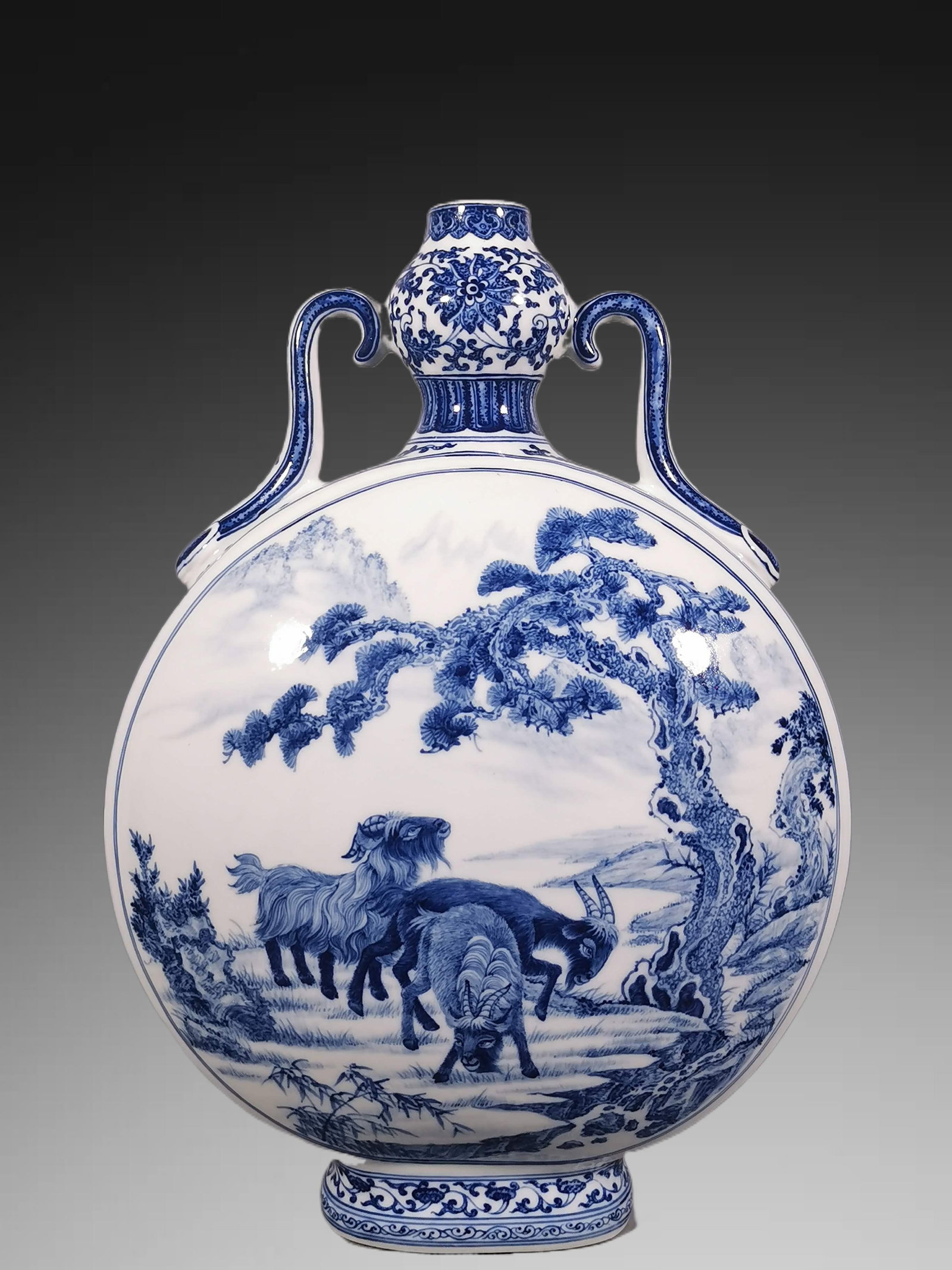 An Exquisite Blue and White Sheep Pattern Double-Ears Vase: An Exquisite Blue and White Sheep Pattern Double-Ears Vase,Qing Dynasty, China,Qianlong Six-character Mark,Size:16.5inx12in 青花羊纹双耳瓶,中国