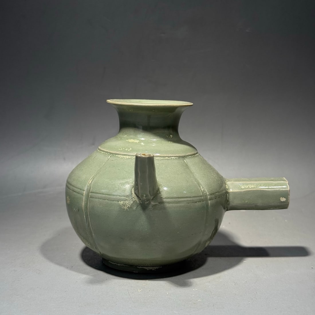 An Exquisite Yue Yao Melon Ribbed Ewer: An Exquisite Yue Yao Melon Ribbed Ewer,Tang Dynasty, China,Size:3.9inx5.1in 越窑瓜棱把壶,中国唐代