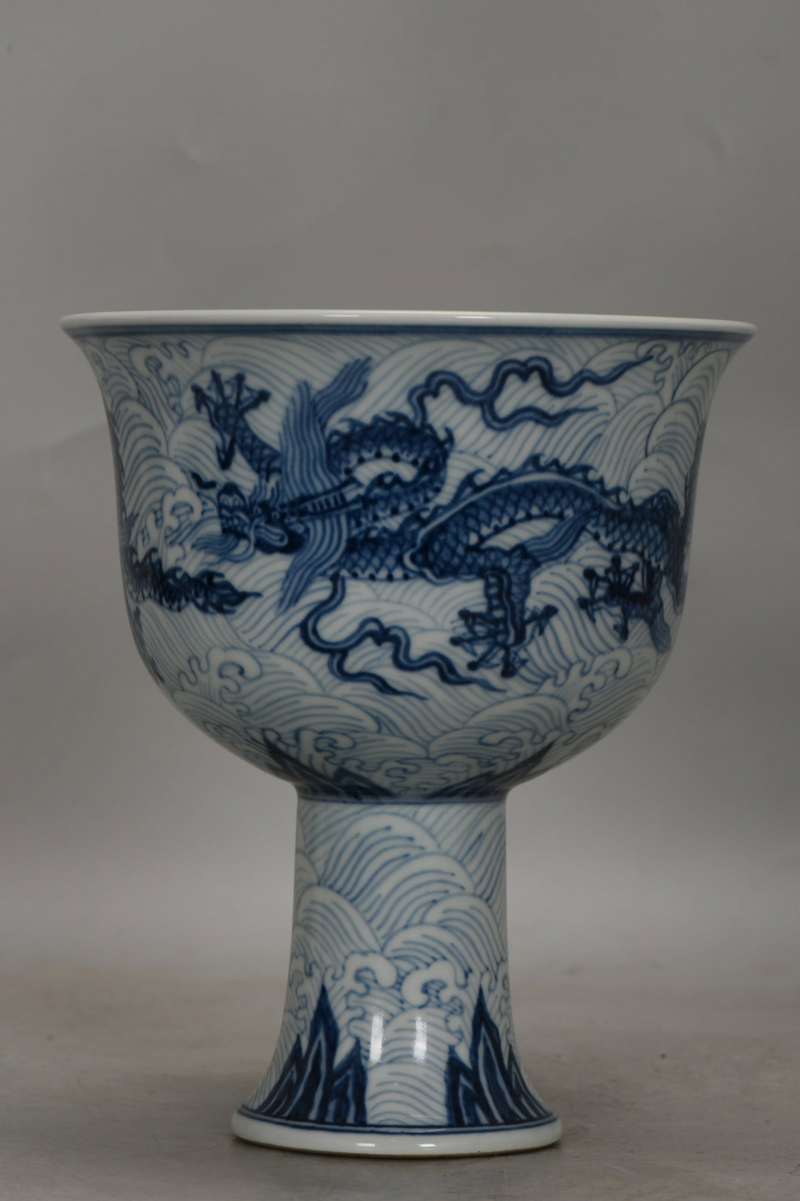 An Exquisite Blue and White Sea Water Dragon Pattern Cup: An Exquisite Blue and White Sea Water Dragon Pattern Cup,Ming Dynasty, China,Xuande Six-character Mark,Size:7.2inx6.1in