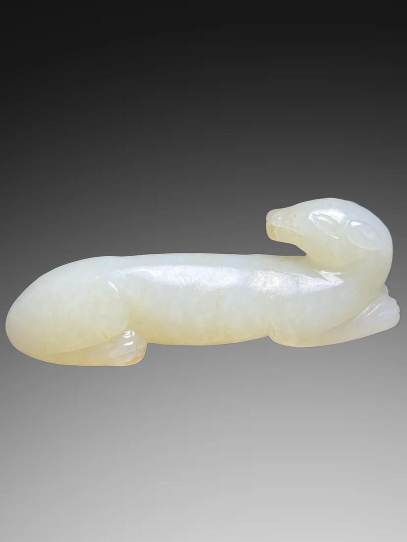 An Exquisite Hotan Jade Dog Handheld Carving: An Exquisite Hotan Jade Dog Handheld Carving,Han Dynasty, China,Size:3.1inx0.8inx1in,Weight:57g 和田玉犬手把件,中国汉代