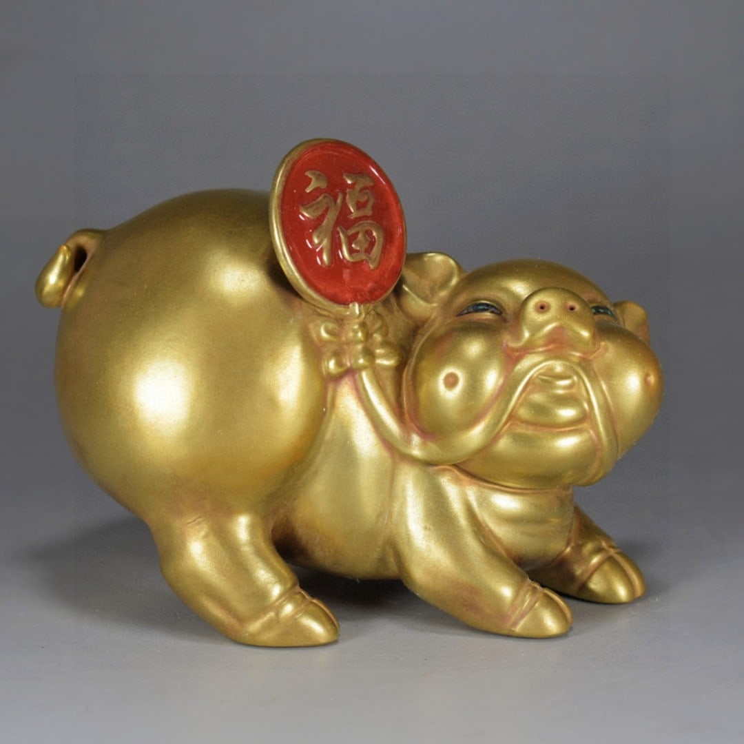An Exquisite Guan yao Gilt Pig Ornament: An Exquisite Guan yao Gilt Pig Ornament,Qing Dynasty, China,Yongzheng Four-character Mark,Size:5.1inx6.3in