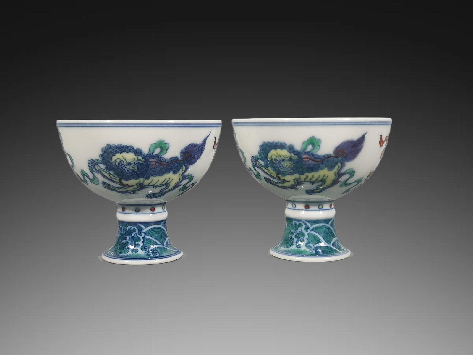 A pair of Exquisite Blue and White Doucai Lion Pattern Cup: A pair of Exquisite Blue and White Doucai Lion Pattern Cup,Qing Dynasty, China,Yongzheng Six-character Mark,Size:3.1inx3.5in