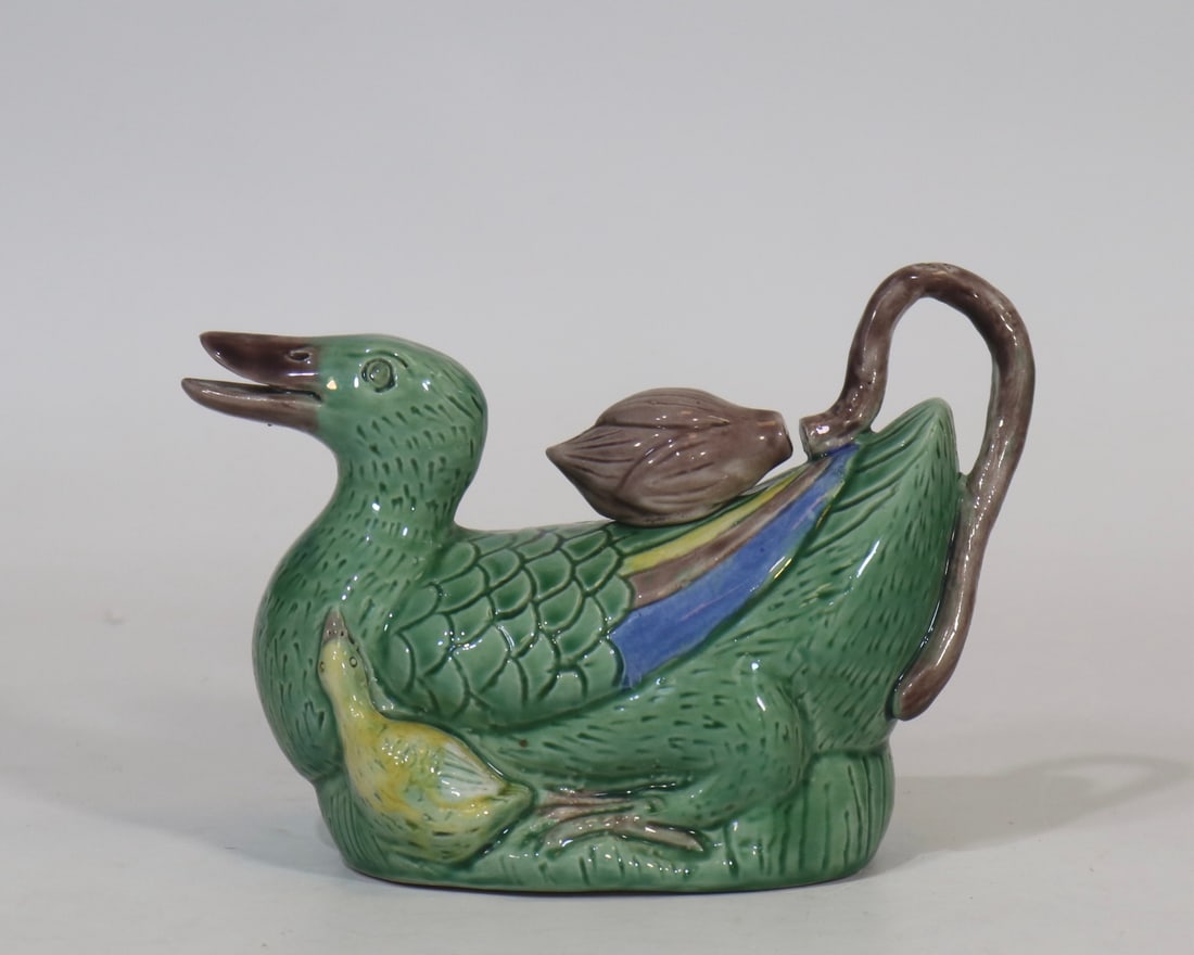 An Exquisite Tri-Color Glazed Duck-Shaped Water Pot: An Exquisite Tri-Color Glazed Duck-Shaped Water Pot,Qing Dynasty, China,Size:4.7inx6.7in 三彩鸭形仿生瓷水滴,中国清代