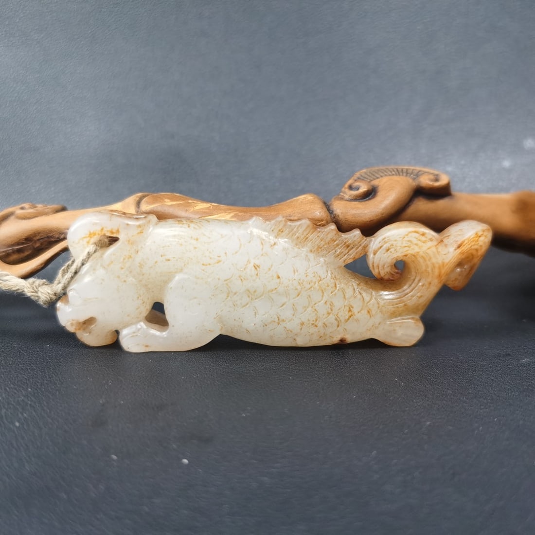 An Exquisite Hotan Jade Dragon-Fish Ornament: An Exquisite Hotan Jade Dragon-Fish Ornament,Han Dynasty, China,Size:3.7inx1.1inx0.5in,Weight:57g 和田玉龙鱼,中国汉代
