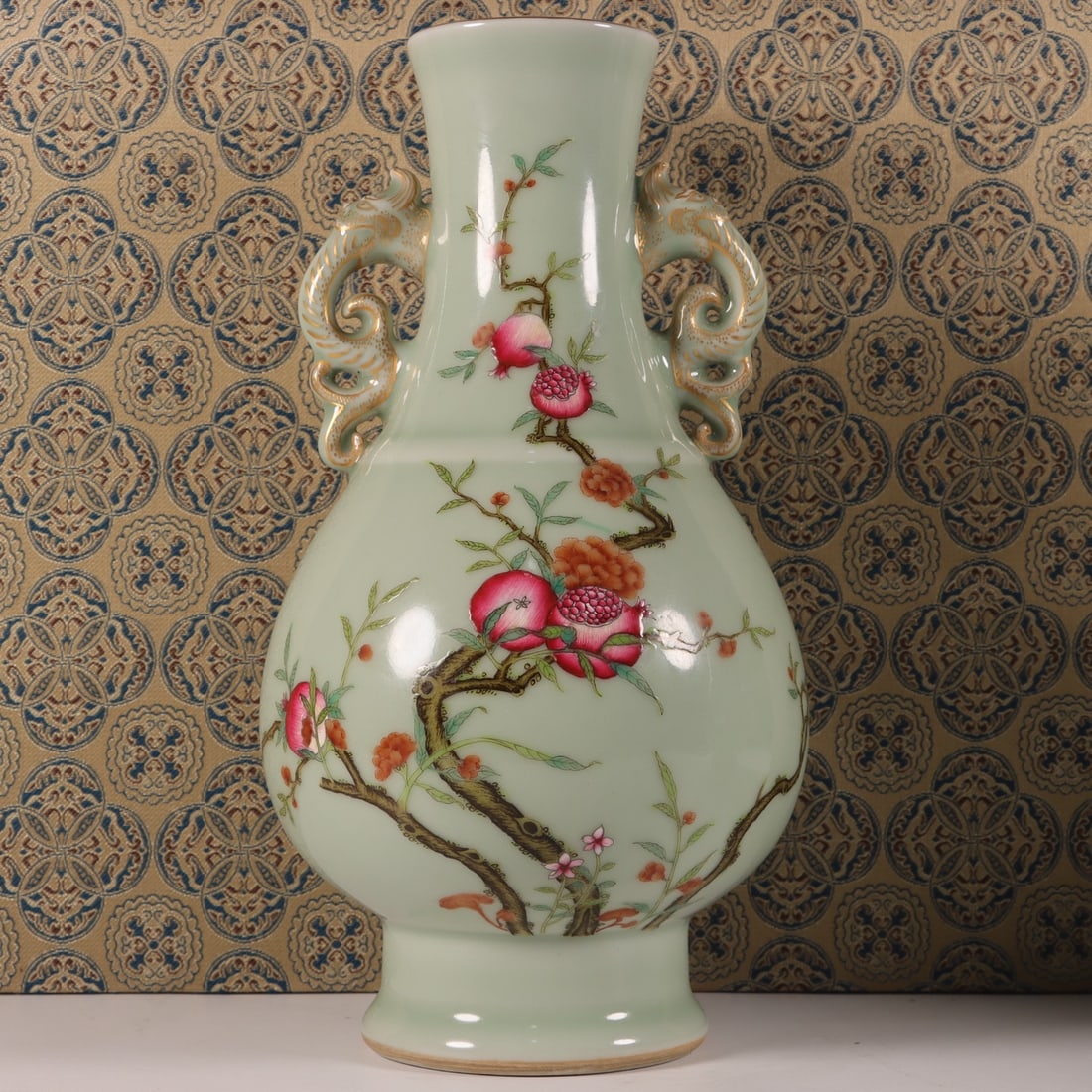 An Exquisite Pea-Green Glazed Famille-Rose Pomegranate Pattern Dragon-Ears Vase: An Exquisite Pea-Green Glazed Famille-Rose Pomegranate Pattern Dragon-Ears Vase,Qing Dynasty, China,Qianlong Six-character Mark,Size:8.9inx4.7inx3in 豆青釉粉彩石