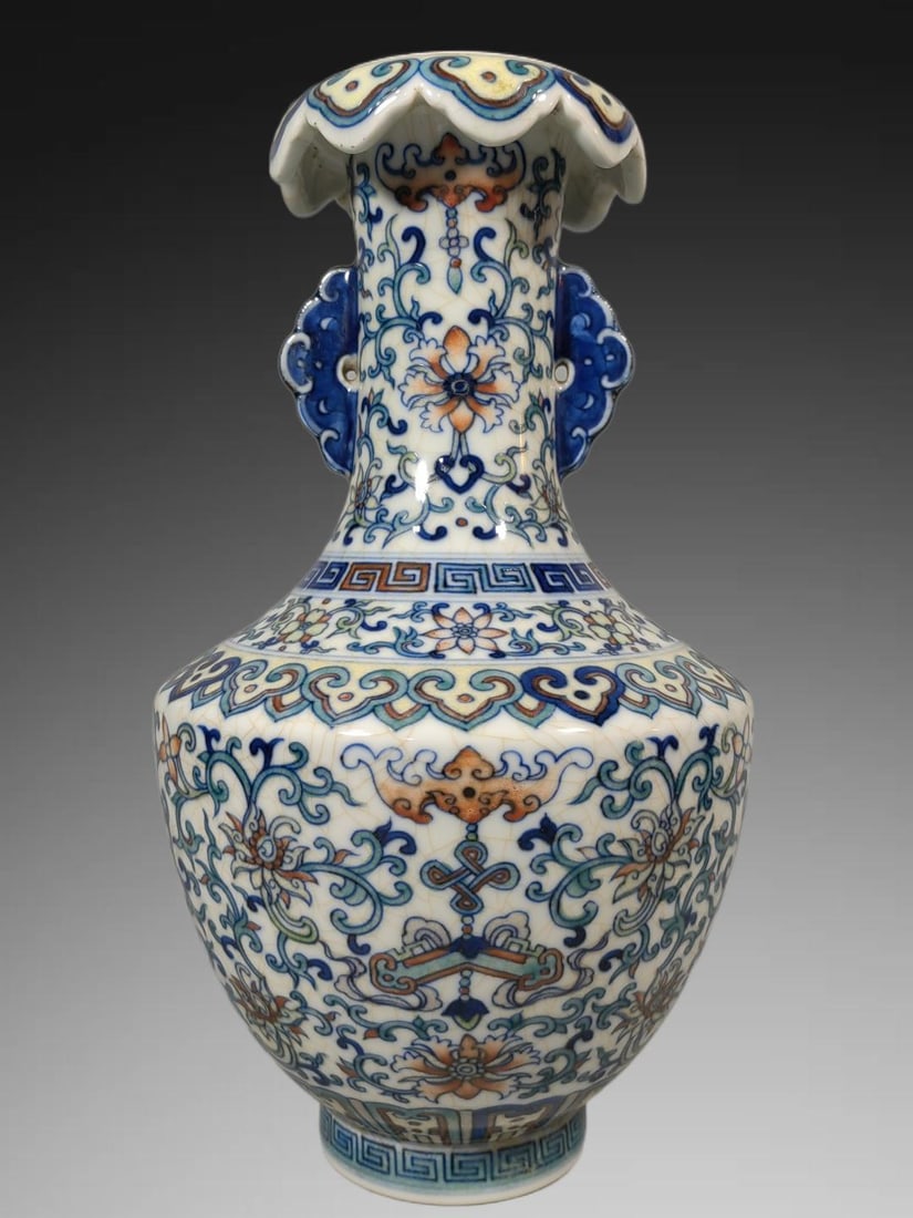 An Exquisite Doucai Lotus Pattern Double-Ears Vase: An Exquisite Doucai Lotus Pattern Double-Ears Vase,Qing Dynasty, China,Yongzheng Six-character Mark,Size:9.3inx5.7in 斗彩缠枝莲纹双耳瓶,中&#