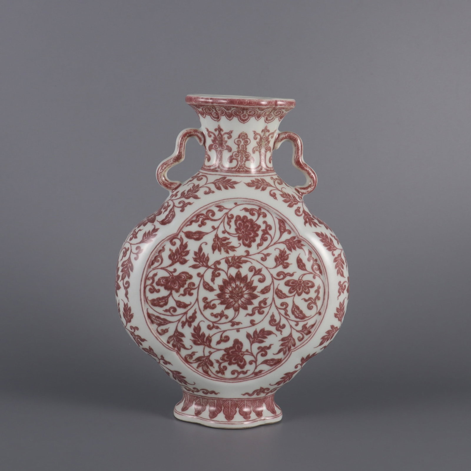 An Exquisite Underglaze-Red Lotus Pattern Double-Ears Vase: An Exquisite Underglaze-Red Lotus Pattern Double-Ears Vase,Qing Dynasty, China,Qianlong Six‑character Mark,Size:10.2inx7.1inx3.3in 釉里红缠枝莲纹双