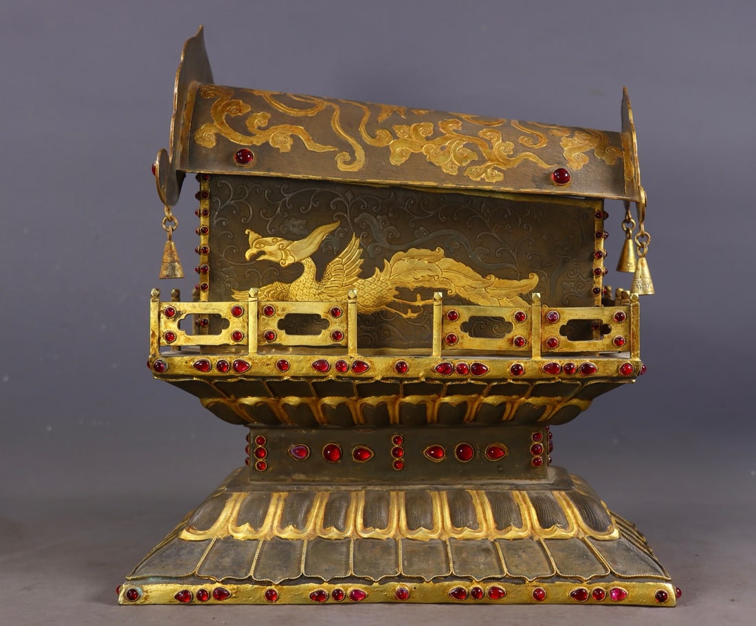 An Exquisite Gilt Bronze Lotus,Figure and Phoenix Pattern Coffin-Shaped Ornament: An Exquisite Gilt Bronze Lotus,Figure and Phoenix Pattern Coffin-Shaped Ornament,Tang Dynasty,China,Zhenguan Four-character Mark,Size:11inx9.8inx6.9in,Weight:3016g铜鎏金缠ĉ