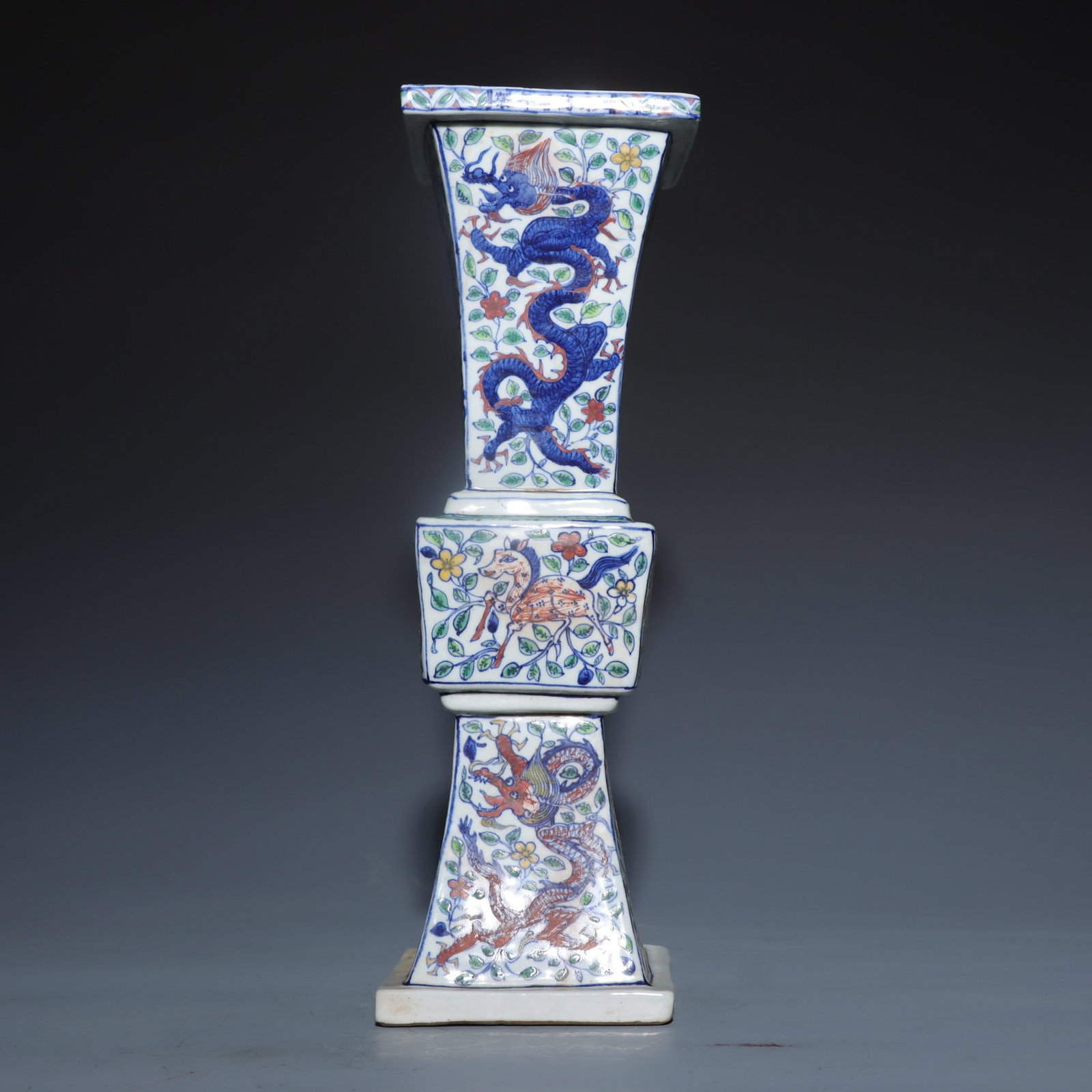 A Rare Blue and White Wucai Lotus and Dragon Pattern Vase: A Rare Blue and White Wucai Lotus and Dragon Pattern Vase,Ming Dynasty,China,Wanli Six-character Mark,Size:14.6inx3.9inx4.5in青花五彩缠枝莲龙纹