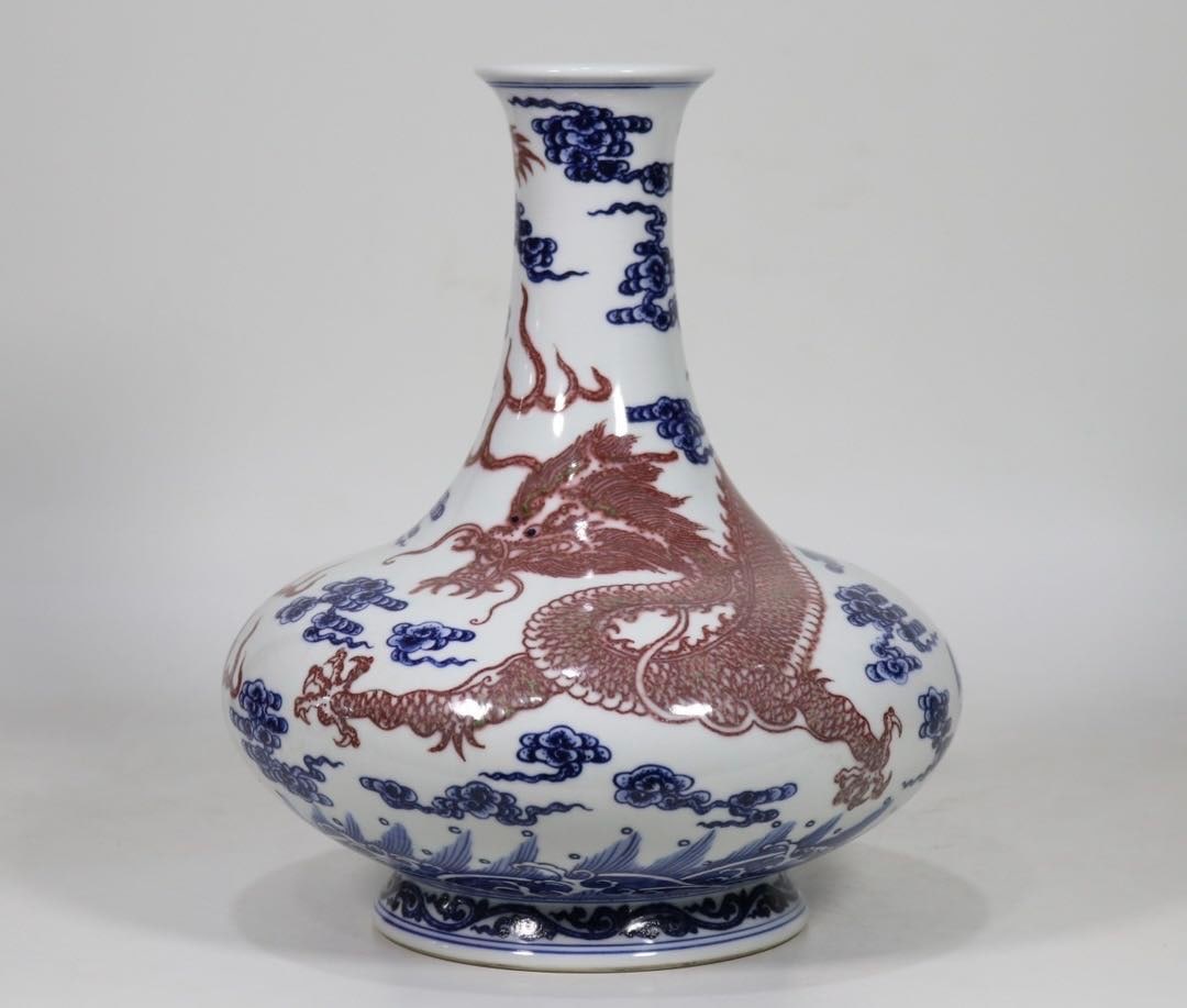 An Exquisite Blue and White Underglaze-Red Seawater,Auspicious Cloud and Dragon Pattern Vase: An Exquisite Blue and White Underglaze-Red Seawater,Auspicious Cloud and Dragon Pattern Vase,Qing Dynasty, China,Qianlong Six-character Mark,Size:10.4inx8.3in青花釉里红&#