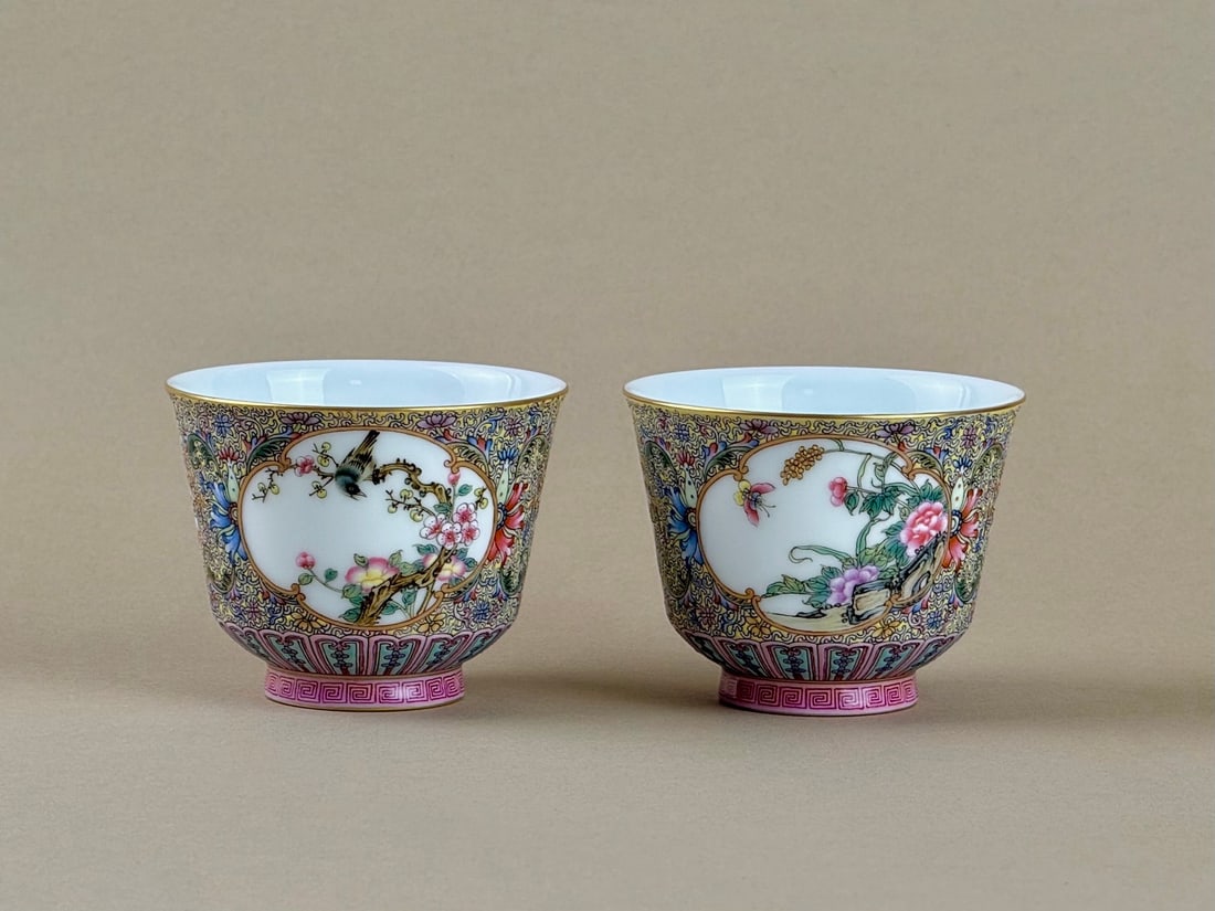 A Pair of Exquisite Famille-Rose Painted Gold Flower and Bird Pattern Cups: A Pair of Exquisite Famille-Rose Painted Gold Flower and Bird Pattern Cups,Qing Dynasty,China,Qianlong Four-character Mark,Size:2.8inx2.2inx1.4in一对粉彩描金花