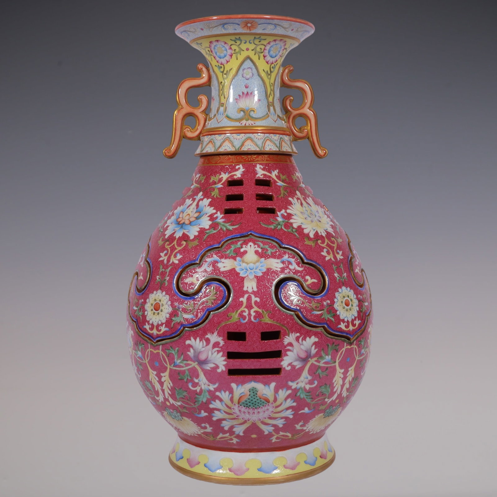 A Huge Famille-Rose Ruby Red-Ground Painted Gold Hollow Lotus Pattern Vase: A Huge Famille-Rose Ruby Red-Ground Painted Gold Hollow Lotus Pattern Vase,Qing Dynasty, China,Qianlong Six-character Mark,Size:24.3inx11.8inx9.4in粉彩胭脂红地ÿ