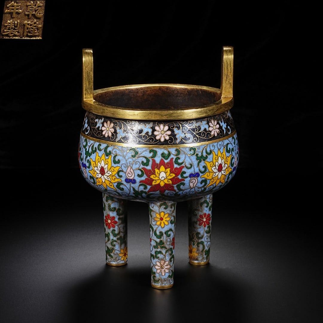 An Exquisite Cloisonne Lotus Pattern Double-Ears and Tripod Censer: An Exquisite Cloisonne Lotus Pattern Double-Ears and Tripod Censer Qing Dynasty, China Qianlong Four-character Mark Size:6.9inx5.1in Weight:1400g景泰蓝鼎式炉