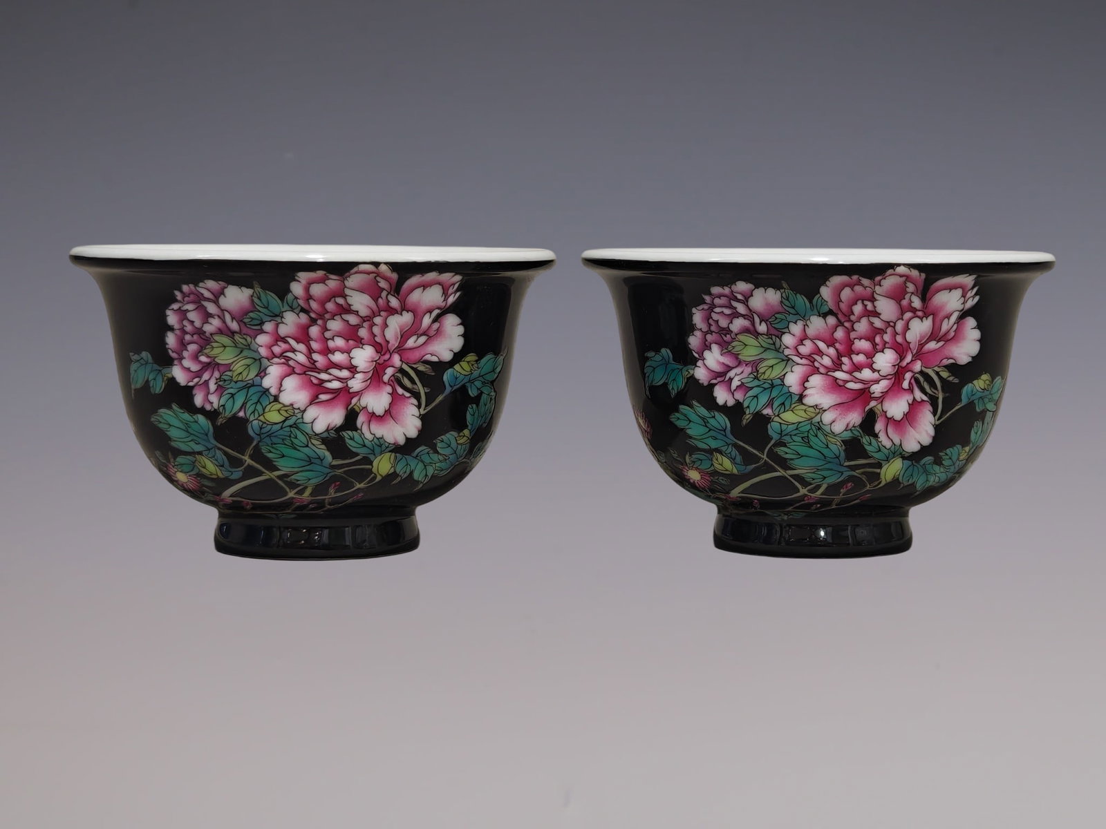 A Pair of Exquisite Famille-Rose Black Ground Flower Pattern Cups,With Poem: A Pair of Exquisite Famille-Rose Black Ground Flower Pattern Cups,With Poem,Qing Dynasty, China,Yongzheng Four-character Mark,Size:2inx3.1in一对粉彩黑地花