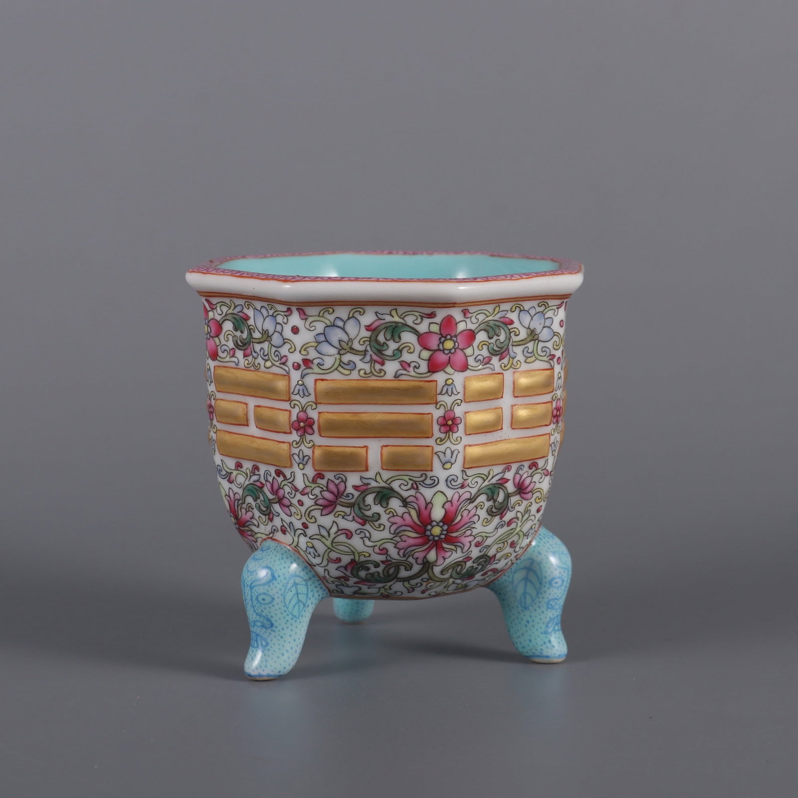 An Exquisite Famille-Rose Painted Gold Lotus and Trigram Pattern Tripod Censer: An Exquisite Famille-Rose Painted Gold Lotus and Trigram Pattern Tripod Censer,Qing Dynasty, China,Qianlong Six-character Mark,Size:2.9inx2.8inx2.4in粉彩描金缠枝