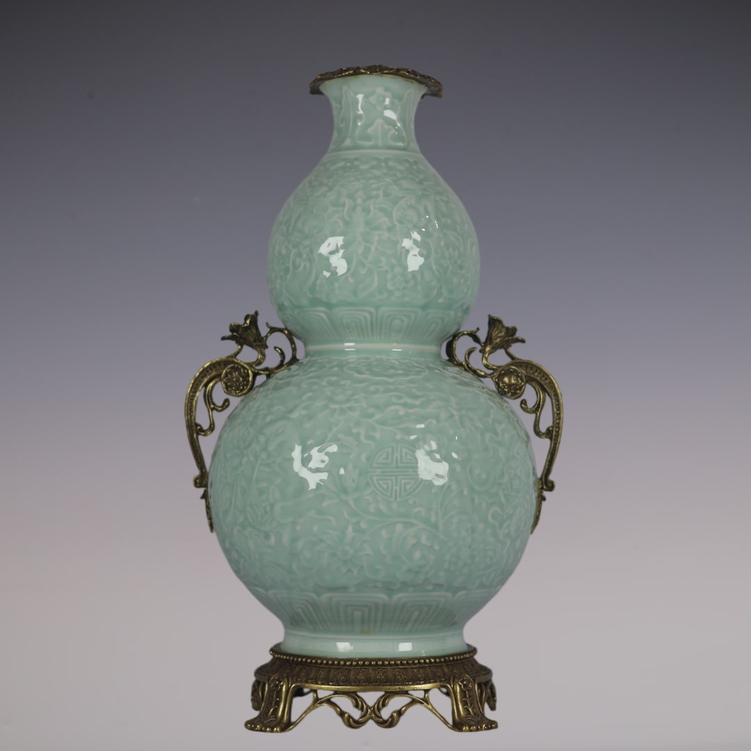 A Huge Celadon Glazed Inlaid Bronze Lotus and Lion Pattern Double-Ears Gourd Vase: A Huge Celadon Glazed Inlaid Bronze Lotus and Lion Pattern Double-Ears Gourd Vase,Qing Dynasty,China,Qianlong Six-character Mark,Size:18.9inx10.6inx7.9in粉青釉镶铜缠