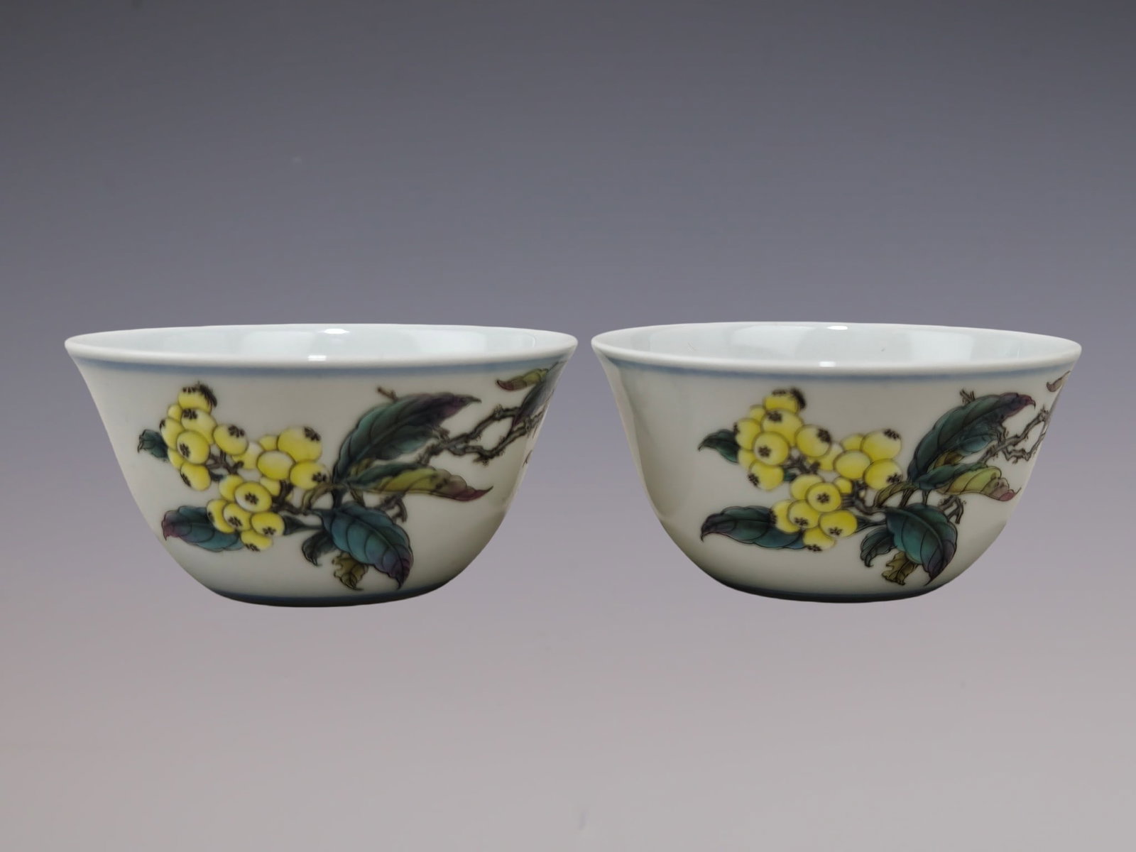A Pair of Exquisite Famille-Rose Loquat Pattern Cups: A Pair of Exquisite Famille-Rose Loquat Pattern Cups,Qing Dynasty, China,Yongzheng Six-character Mark,Size:1.4inx2.8in一对粉彩枇杷纹杯,中国&