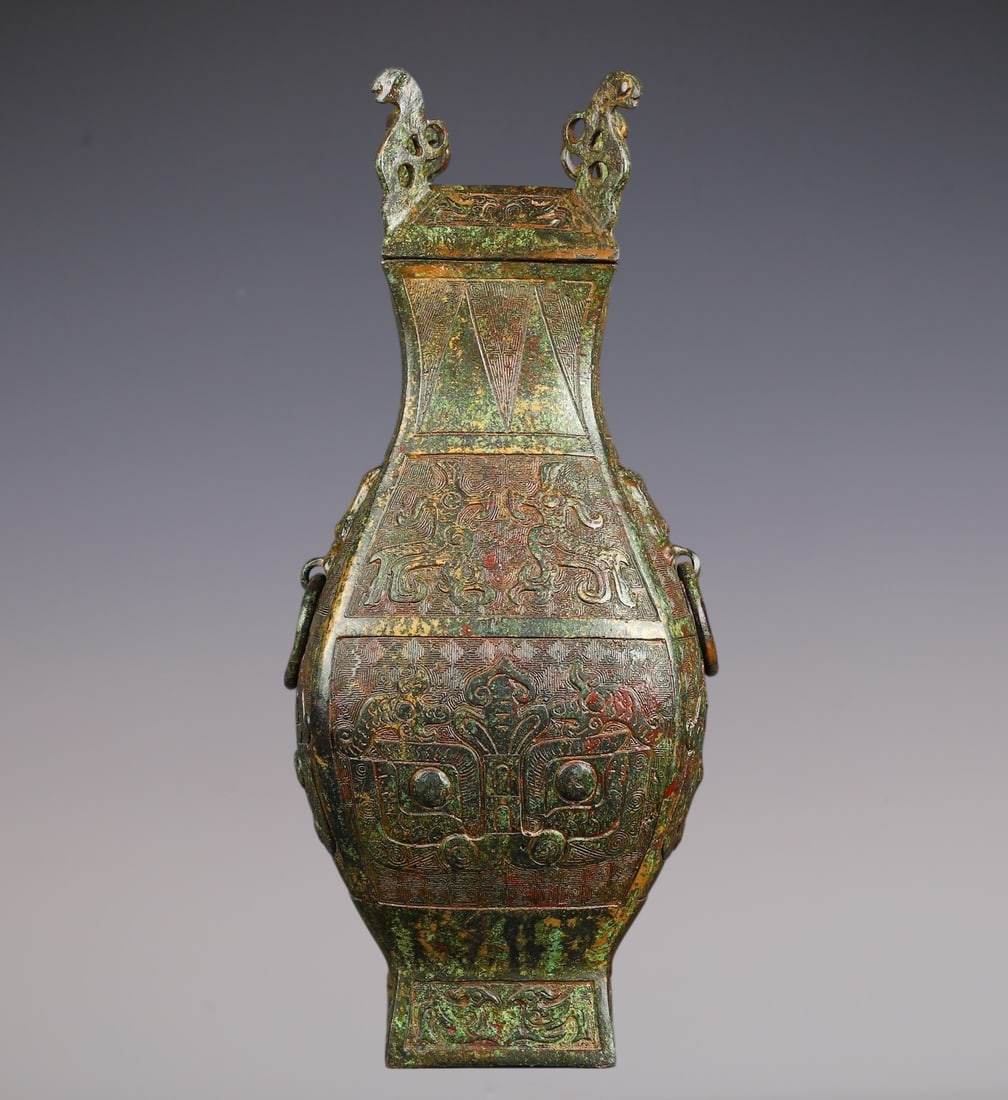 An Archaic Bronze Beast-Face Pattern Beast-Ears Vase with Cover: An Archaic Bronze Beast-Face Pattern Beast-Ears Vase with Cover,W.Zhou , China,Size:6.3inx14.2in,Weight:3050g青铜兽面纹兽耳盖瓶,中国&#