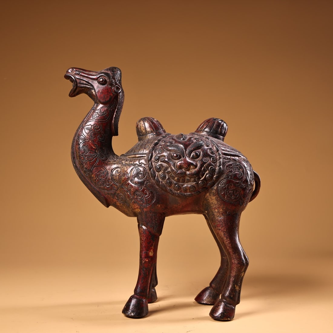 An Exquisite Bronze Lacquer Gilt Beast-Face Pattern Camel Ornament: An Exquisite Bronze Lacquer Gilt Beast-Face Pattern Camel Ornament,Qing Dynasty,China,Size:9.8inx8.7in,Weight:1920g铜漆金兽面纹骆驼摆件ʌ