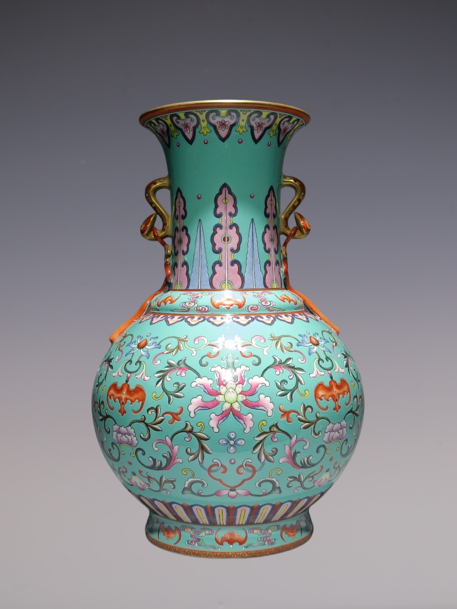 A Rare Famille-Rose Turquoise Ground Painted Gold Lotus and Bats Pattern Ruyi-Ears Vase: A Rare Famille-Rose Turquoise Ground Painted Gold Lotus and Bats Pattern Ruyi-Ears Vase,Qing Dynasty, China,Qianlong Six-character Mark,Size:14.2inx9.4in粉彩松石绿地