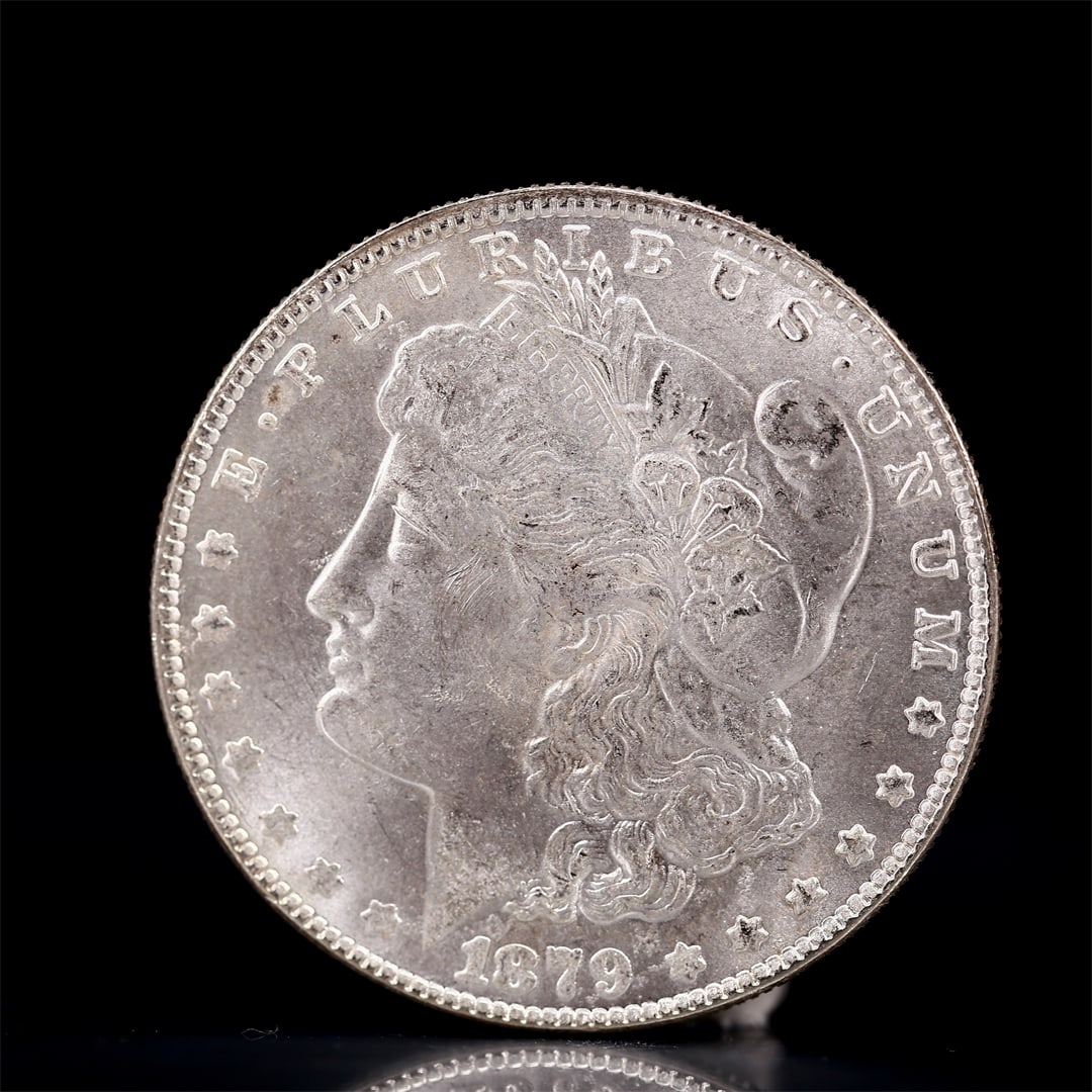 USA Morgan Dollar 1879 Coin: Obv: profile bust with date below and E PLURIBUS UNUM legend and stars around. Rev: eagle with In God we trust above within wreath with UNITED STATES OF AMERICA ONE DOLLAR legend. IN GOD WE TRUST /