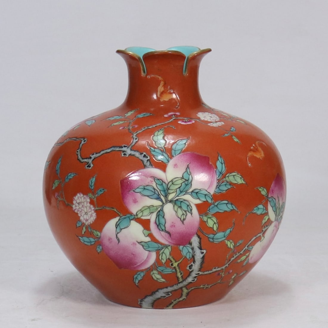 An Exquisite Coral Red-Ground Famille-Rose Painted Gold Bats and Peach Pattern Pomegranate-Shaped: An Exquisite Coral Red-Ground Famille-Rose Painted Gold Bats and Peach Pattern Pomegranate-Shaped Vase,Qing Dynasty, China,Qianlong Six-character Mark,Size:8.1inx3.1in珊瑚红地&
