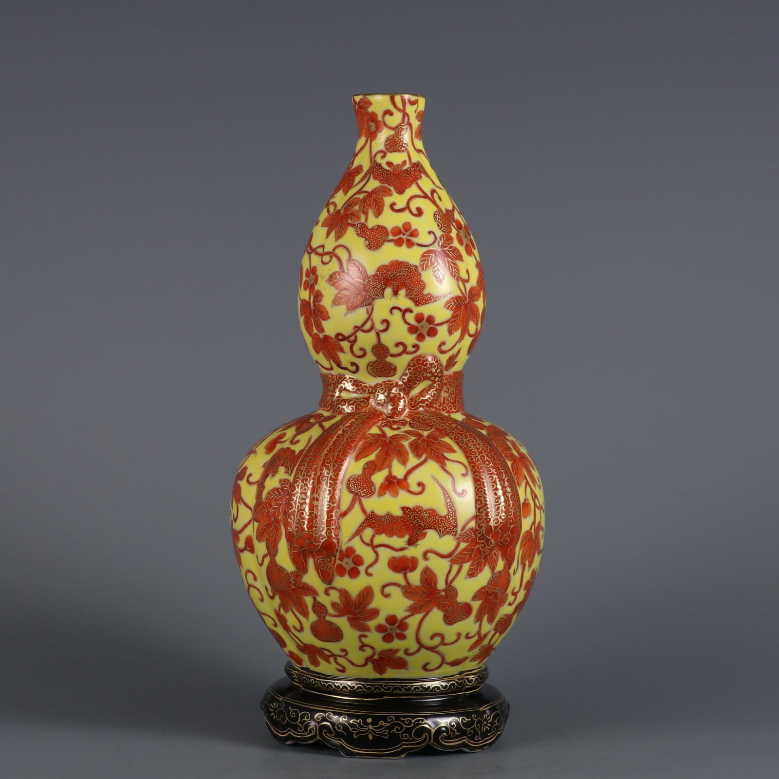 An Exquisite Yellow Ground Iron-Red Glazed Painted Gold Bats and Gourd Pattern Gourd-Shaped Vase: An Exquisite Yellow Ground Iron-Red Glazed Painted Gold Bats and Gourd Pattern Gourd-Shaped Vase,Qing Dynasty, China,Qianlong Six-character Mark,Size:9.8inx4.7in黄地矾红釉