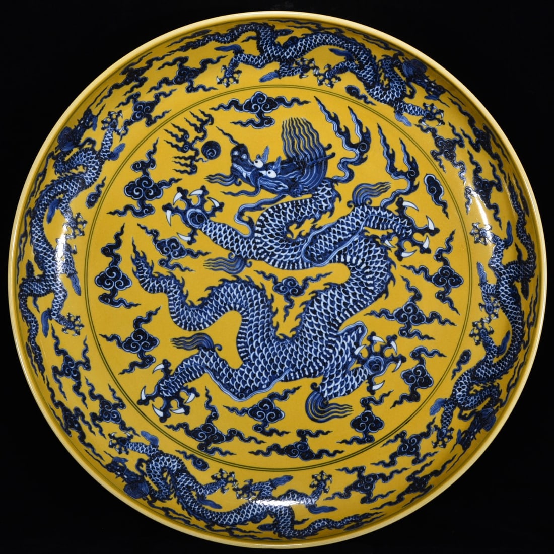 A Huge Yellow Ground Blue and White Auspicious Cloud and Dragon Pattern Plate: A Huge Yellow Ground Blue and White Auspicious Cloud and Dragon Pattern Plate,Ming Dynasty,