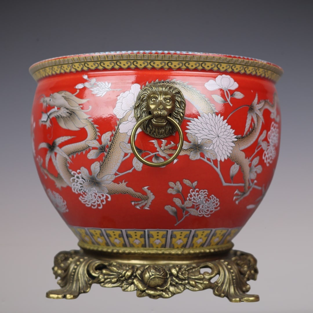 A Rare Red Ground Famille-Rose Inlaid Bronze Flower and Dragon Pattern Lion-Ears Vat: A Rare Red Ground Famille-Rose Inlaid Bronze Flower and Dragon Pattern Lion-Ears Vat,Qing Dynasty,China,With
