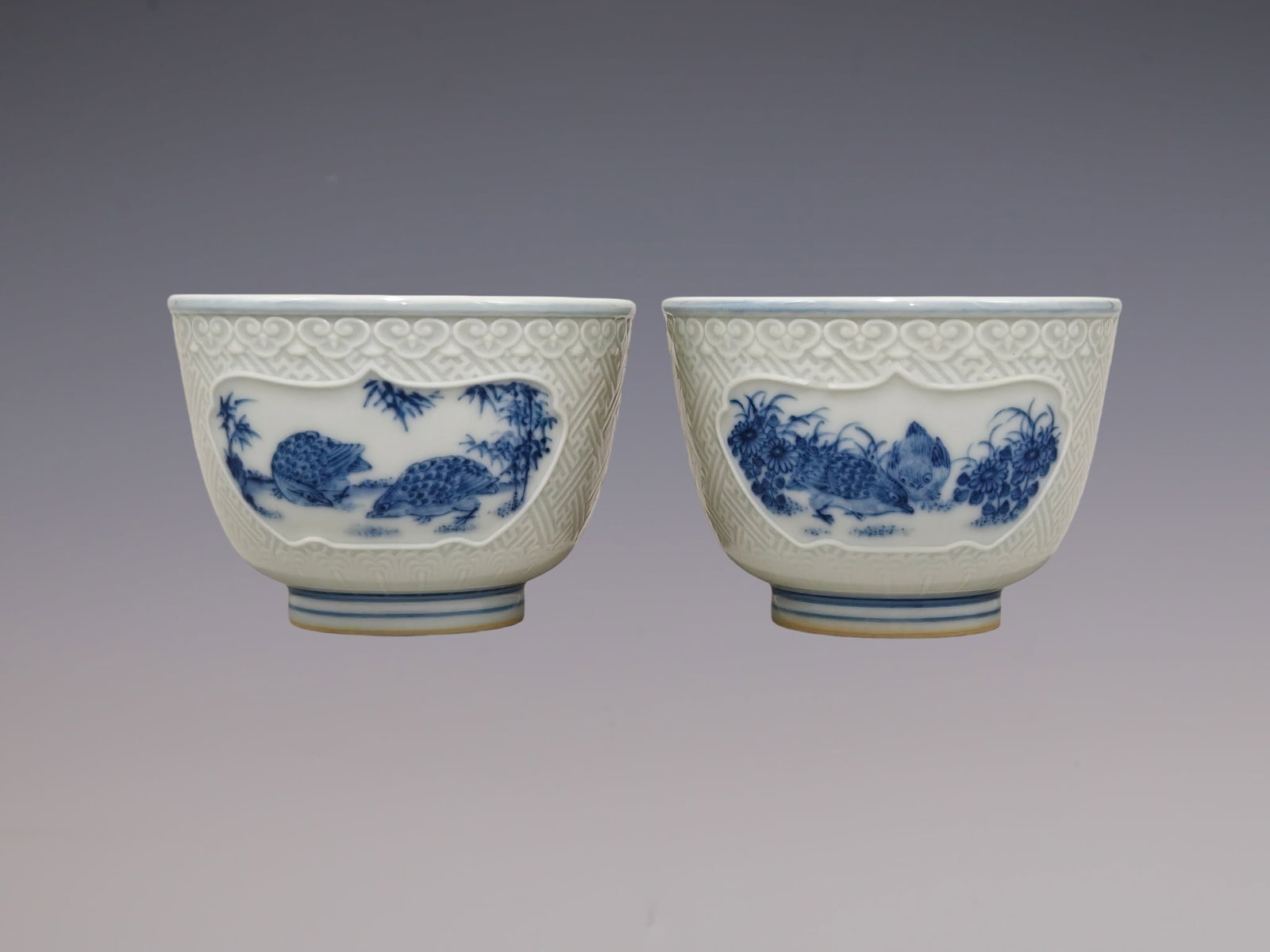 A Pair of Exquisite Blue and White Flower and Bird Pattern Cups: A Pair of Exquisite Blue and White Flower and Bird Pattern Cups,Qing Dynasty, China,Yongzheng Six-character Mark,Size:2.2inx3.1in一对青花花鸟纹杯,ߑ