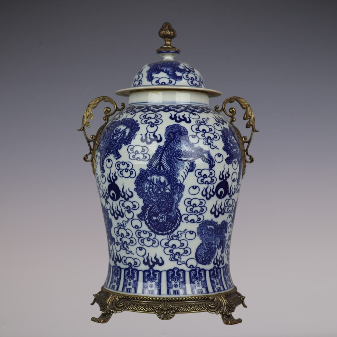 A Huge Blue and White Inlaid Bronze Auspicious Cloud and Lion Pattern Double-Ears Jar with Cover: A Huge Blue and White Inlaid Bronze Auspicious Cloud and Lion Pattern Double-Ears Jar with Cover,Qing Dynasty,China,Kangxi Six-character Mark,Size:20.5inx11.8inx10.6in青花镶铜&
