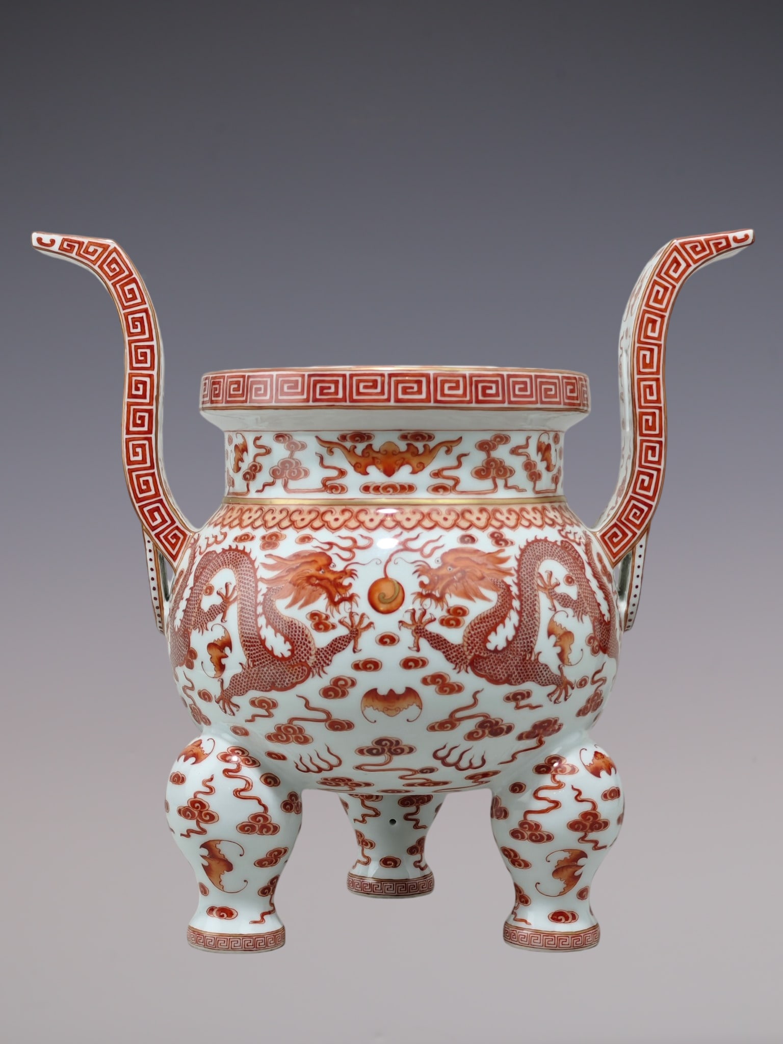 A Rare Iron-Red Glazed Painted Gold Auspicious Cloud and Dragon Pattern Double-Ears and Tripod: A Rare Iron-Red Glazed Painted Gold Auspicious Cloud and Dragon Pattern Double-Ears and Tripod Censer,Qing Dynasty, China,Qianlong Six-character Mark,Size:14.8inx15.2in矾红釉描