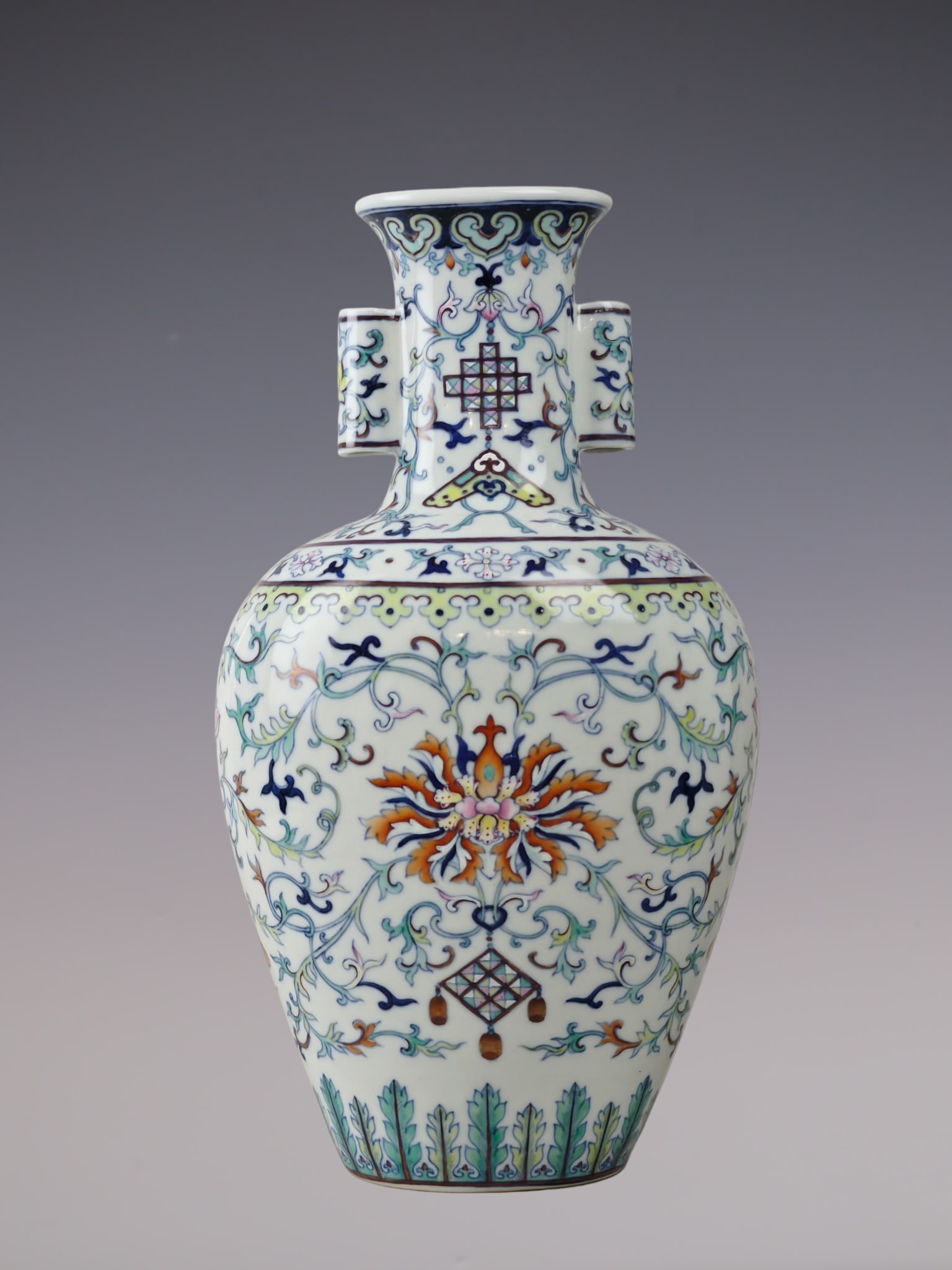 A Rare Blue and White Doucai Lotus Pattern Double-Ears Vase: A Rare Blue and White Doucai Lotus Pattern Double-Ears Vase,Qing Dynasty, China,Qianlong Six-character Mark,Size:12.6inx7.1in青花斗彩缠枝莲纹双
