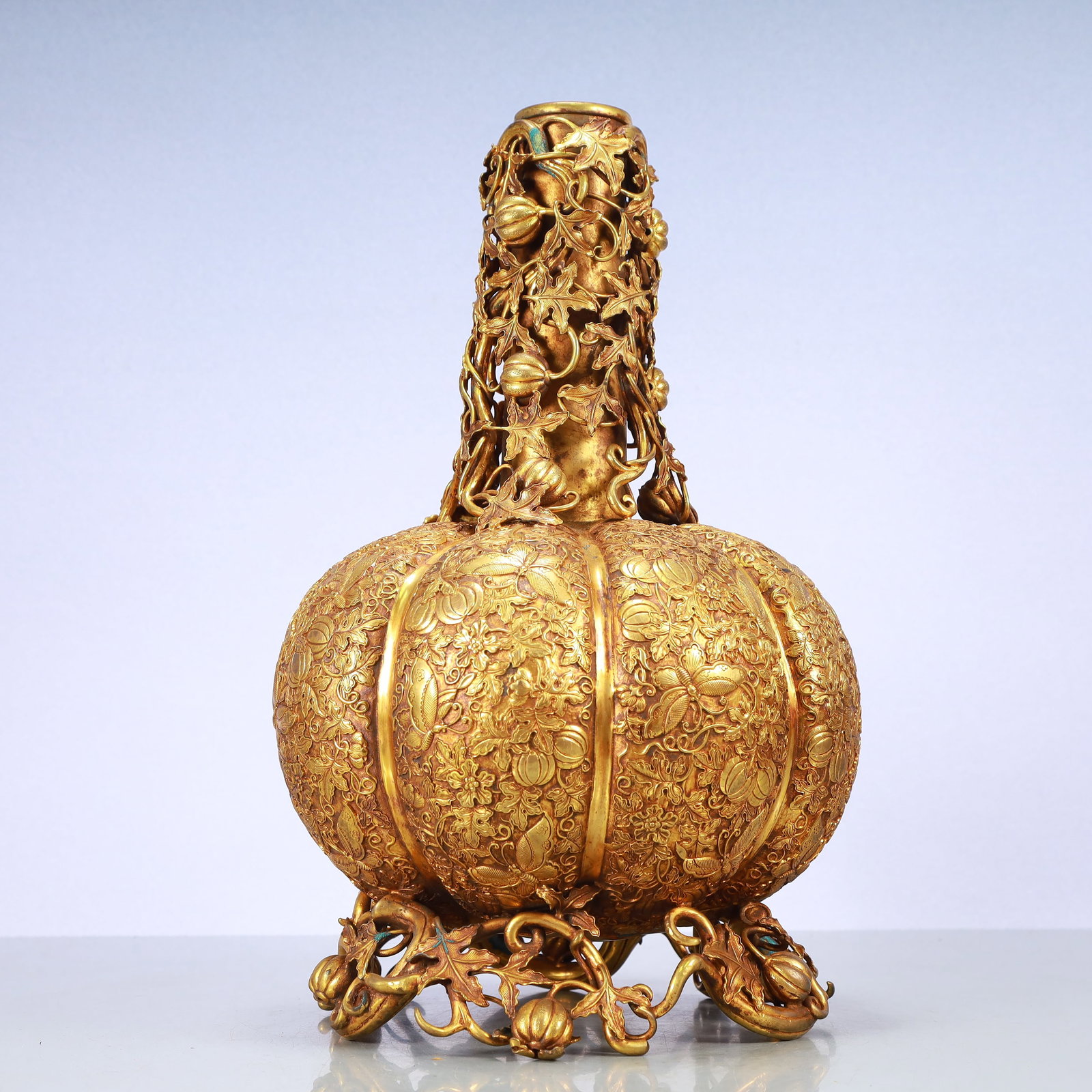 A Exquisite Gilt Bronze Flower and Fruit Pattern Vase: A Exquisite Gilt Bronze Flower and Fruit Pattern Vase Qing Dynasty, China Qianlong Four-character Mark Size:9.1inx16.5in Weight:7500g铜鎏金花果纹瓶 中&#