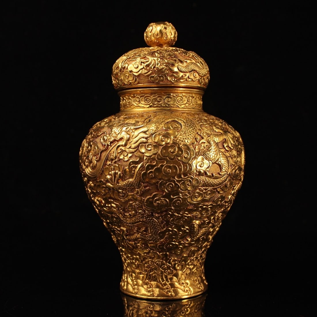 An Exquisite Gilt Bronze Auspicious Cloud and Dragon Pattern Jar with Cover: An Exquisite Gilt Bronze Auspicious Cloud and Dragon Pattern Jar with Cover,Qing Dynasty,China,Qianlong Four-character Mark,Size:7.9inx5.1in,Weight:1738g铜鎏金祥云龙